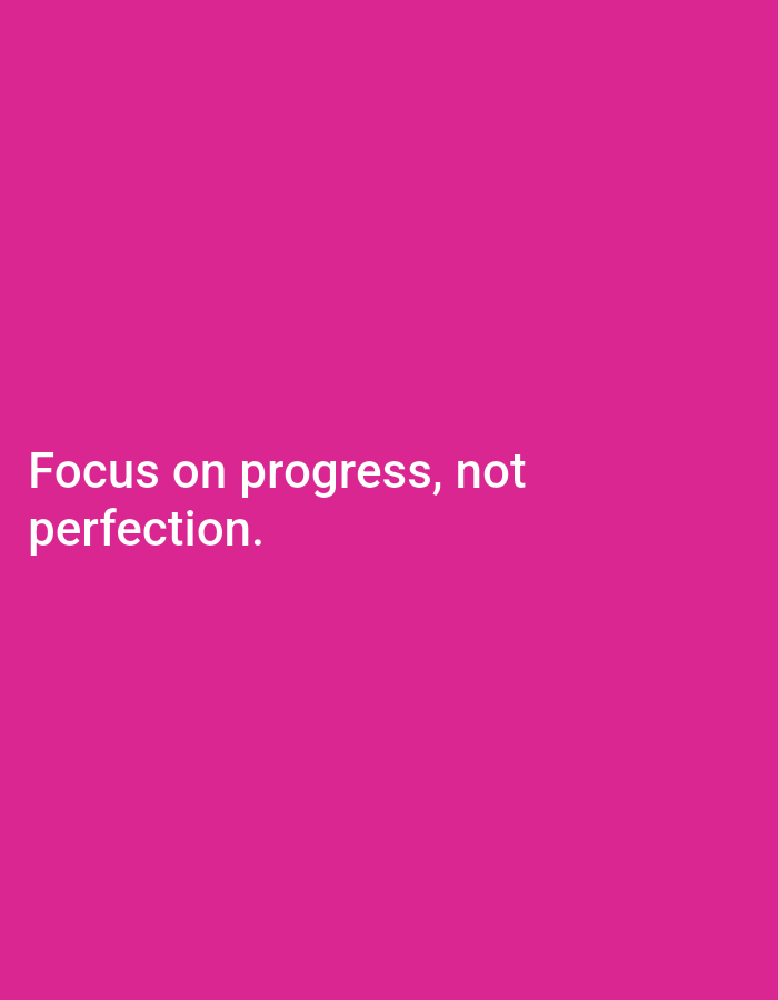 The image contains white text on a vibrant pink background. The text reads "Focus on progress, not perfection." There are no discernible elements related to the city of Jos, Nigeria, or any specific environmental details that would place it there. The image is a simple graphic with a motivational quote.