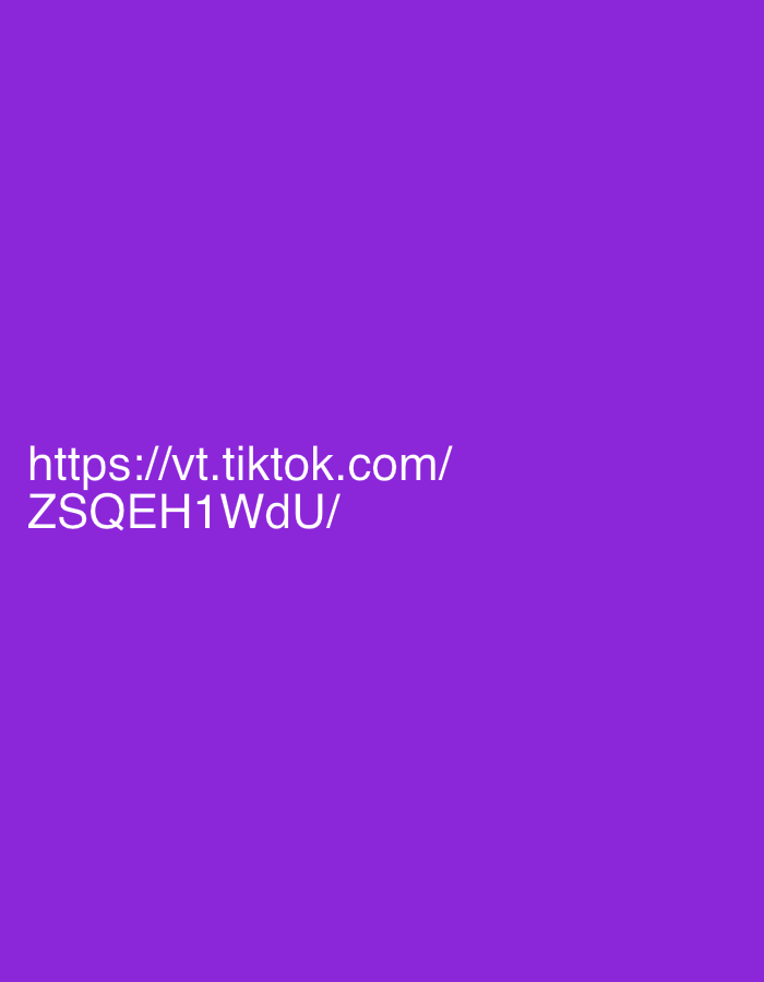 The image is a screenshot of a TikTok URL on a solid purple background. The text reads "https://vt.tiktok.com/ ZSQEH1WdU/". There are no people, subjects, objects, or actions depicted in the image. The environment is a plain purple background. The location in the city of Drożki, Poland is not determinable from the image.
