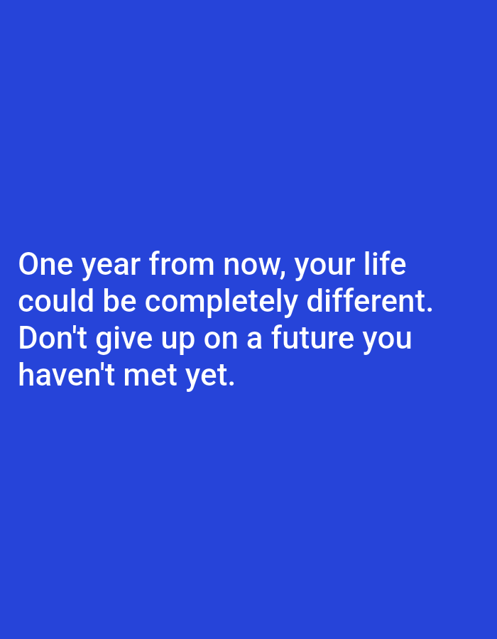 The image is a photograph of white text on a blue background. The text reads: "One year from now, your life could be completely different. Don't give up on a future you haven't met yet." There are no people, objects, or environmental details visible in the image, and no specific location within Алмалыбақ, Kazakhstan, is indicated.