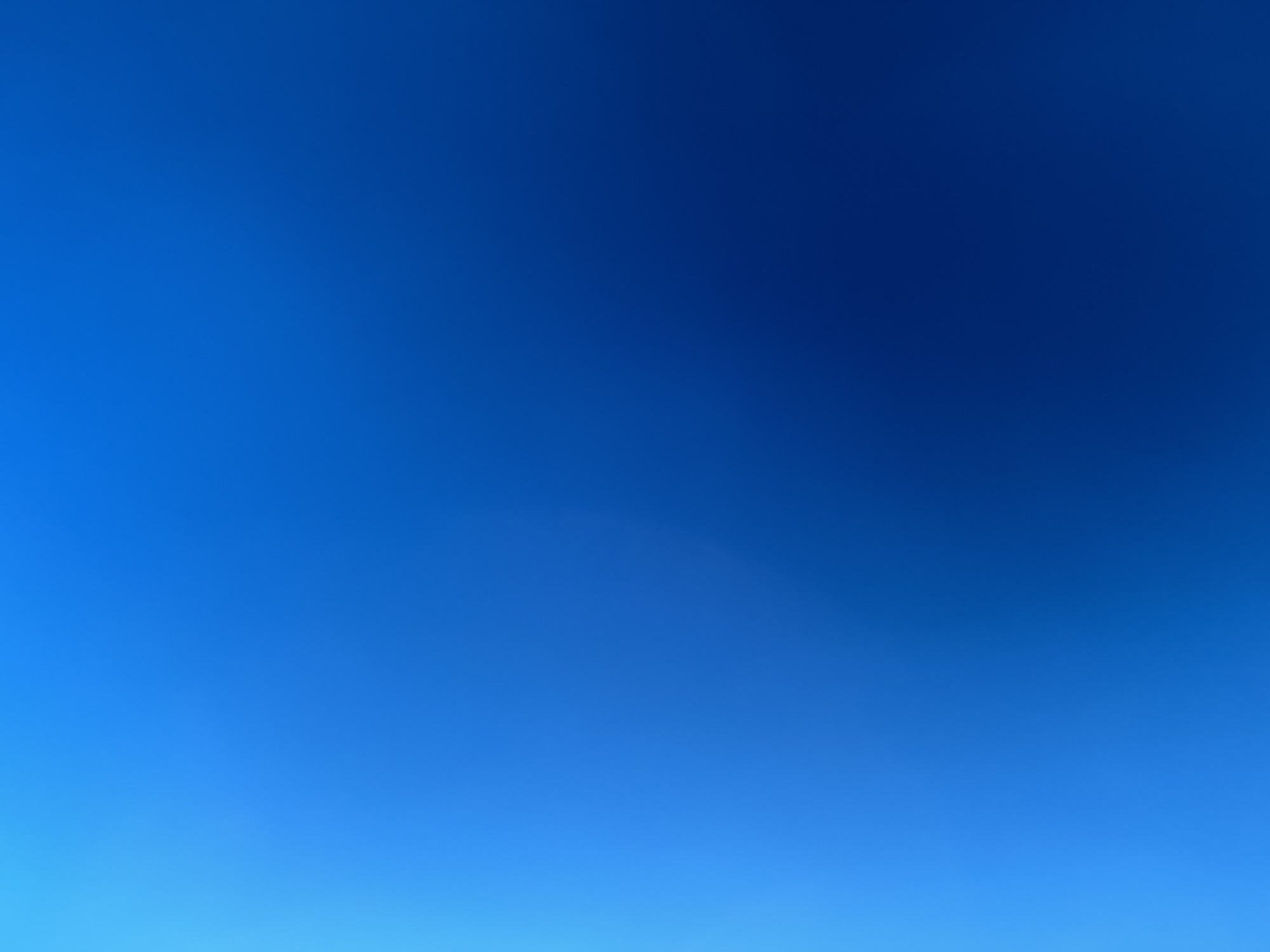 The image is a digitally generated abstract background of a blue gradient. The color transitions from a lighter, brighter blue on the left to a darker, deeper blue on the right. There are no discernible objects, people, or environmental features visible in the image. The scene does not depict any location in the city of Sacramento or anywhere else.