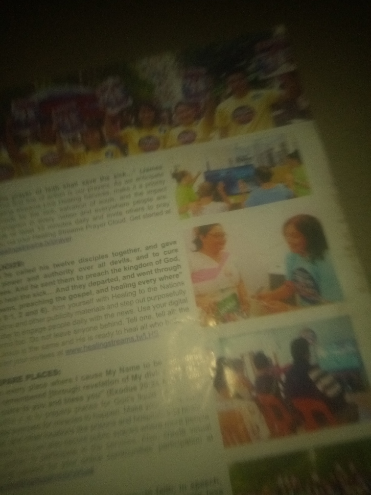 The provided image is a photograph of a printed document, possibly a flyer or a page from a magazine. The document contains text and several small, blurry photographs. The text appears to be religious in nature, with references to prayer, faith, healing, and scripture. The photographs depict groups of people in various settings, including some that seem to be at an event or gathering. There is no discernible information within the image that would allow for the identification of the city of Jauro Yinu, Nigeria. The image quality is poor, making it difficult to discern specific details about the people or their activities.