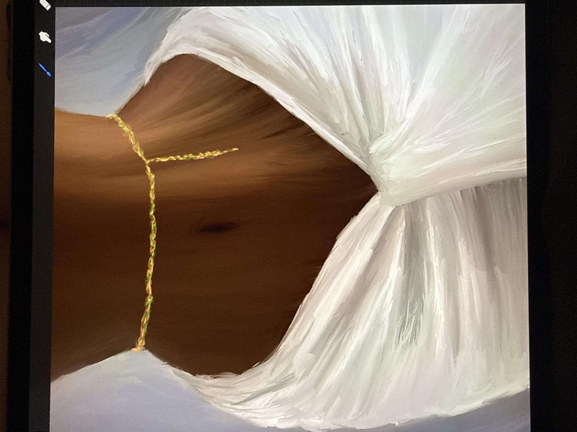 The image shows a close-up view of a person's midsection, from the navel down to the hips. They are wearing a delicate gold chain with small green beads around their waist. The chain is twisted and has a dangling charm. The person is draped in a flowing white fabric that is gathered and pleated around their hips. The background is a soft, light blue. The image appears to be a digital painting or artwork. No specific location in a city is identifiable.