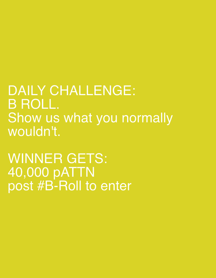 The image is a simple digital graphic featuring white text against a solid, bright yellow background. There are no visible people, objects, or a specific scene depicted beyond the text and color. The text outlines a "DAILY CHALLENGE" focusing on "B ROLL," instructing participants to "Show us what you normally wouldn't." The incentive for winning is stated as "40,000 pATTN," and participants are directed to "post #B-Roll to enter." The overall presentation is clean and direct, designed to convey information about a contest or activity. No specific time of day, weather, or emotions are discernible from the image itself.