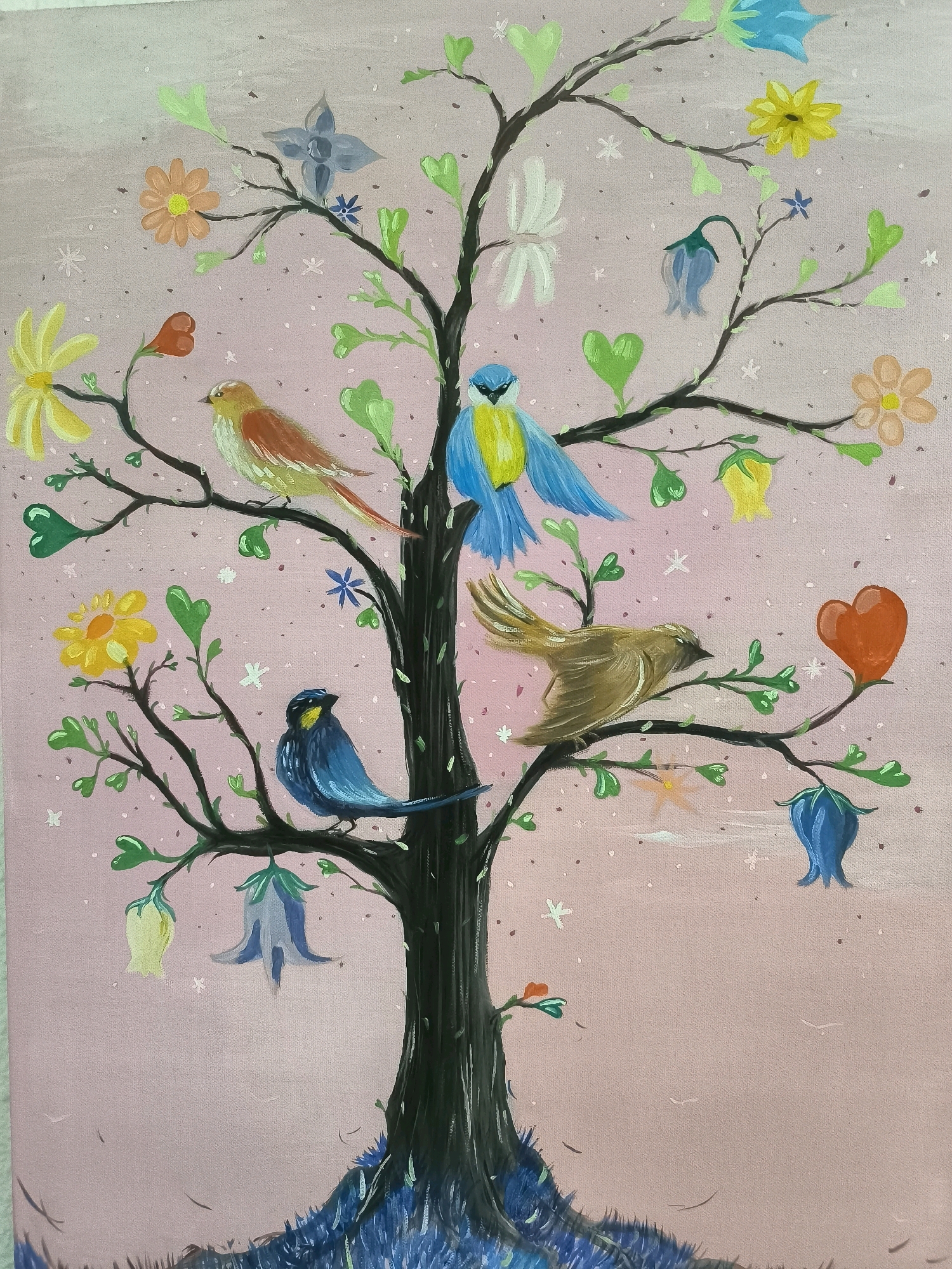 This is a painting of a stylized tree with a pink background. The tree has a dark brown trunk and branches adorned with green leaves shaped like hearts, and various flowers and bell-shaped blossoms in yellow, orange, blue, and red. Several birds are perched on the branches. One bird is primarily blue with yellow accents, another is brown and tan, one is orange and yellow, and the smallest is dark blue with a yellow beak. The overall style is whimsical and illustrative. There is no depiction of the city of València, Spain within the image.