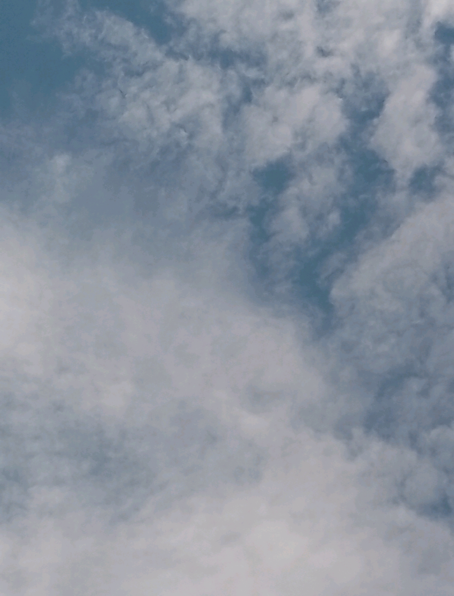 The image shows a sky filled with clouds. There is no visible indication of Lusanja, Uganda or any people, subjects, or objects within the frame. The scene is entirely focused on the atmospheric conditions.