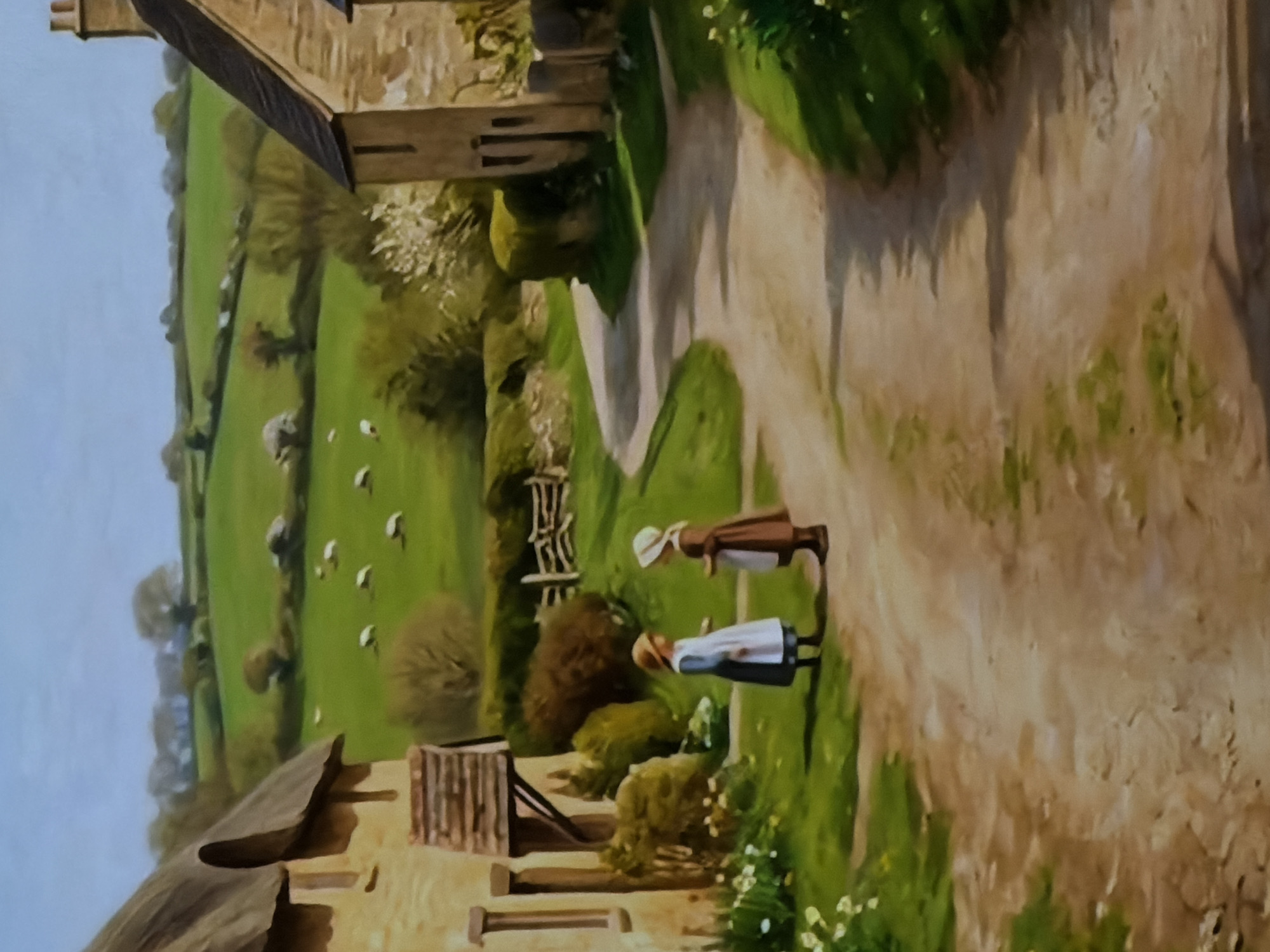 This is a painting depicting a serene, rural village scene, presented in a portrait orientation that should be rotated 90 degrees clockwise for proper viewing. The landscape features rolling green hills or pastures under a clear, light blue sky, suggesting pleasant daytime weather.
In the mid-ground, a winding dirt path leads through the village. Two figures, likely women or girls, are central to the composition, standing on this path and seemingly engaged in conversation. They wear traditional attire: long dresses or skirts, aprons, and bonnets. One figure on the right is dressed in a brown gown with a white apron and a light bonnet, while the other on the left wears a white dress with a dark apron and a brown bonnet.
Several stone-built cottages or houses with dark, possibly thatched or slate roofs are visible. One prominent house stands in the foreground to the lower left, and another in the mid-ground to the upper right. The buildings feature small windows and an rustic architectural style. The landscape is rich with vegetation, including lush green grass, various trees (some with white blossoms), bushes, and small white wildflowers dotting the edges of the path. In the background, several white sheep graze peacefully in the green fields, adding to the pastoral ambiance. Wooden fences and gates are interspersed throughout the scene, delineating properties or enclosures. No visible text is present in the painting. The scene evokes a sense of historical rural life, potentially inspired by regions such as Sofiivska Borshchahivka, Ukraine.