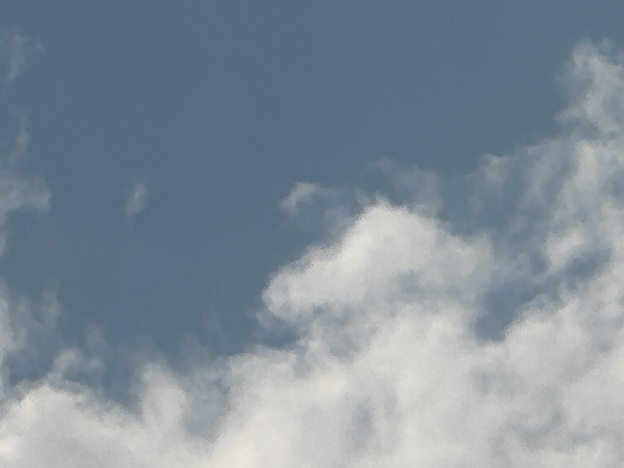 The image shows a cloudy sky. The clouds are white and fluffy, and the sky is a light blue color. The image appears to be taken from the ground, looking up at the sky. There are no people or objects visible in the image. The time of day is likely daytime, as the sky is bright. The weather appears to be clear with some clouds. The location is Zvezdara Urban Municipality, Serbia.