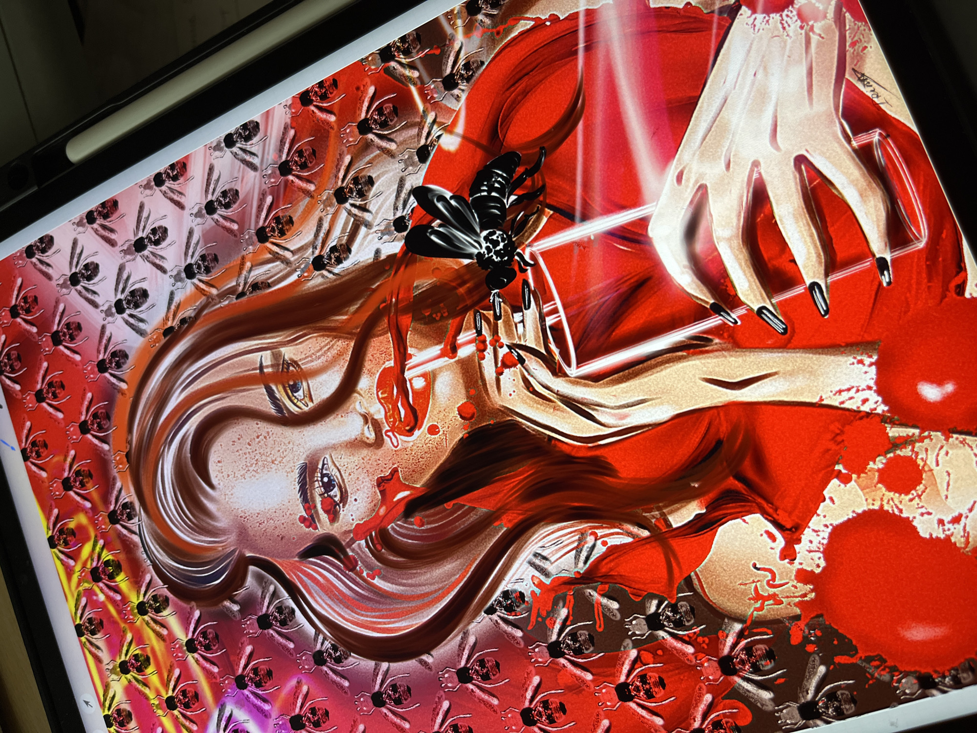 In a digital artwork displayed on a tablet, a woman with auburn hair is depicted. She is wearing a red garment and holding a clear glass containing a red liquid. A large black insect with white markings is perched on the glass, near her hand. The background of the artwork features a repeating pattern of stylized insects in various shades of red and pink. Red splatters are present on the woman's face and chest, and on the surface of the red garment. Her eyes are blue, and her lips are painted red. She has long fingernails painted black. The image is a close-up view, with the right edge of the tablet visible, along with a stylus.