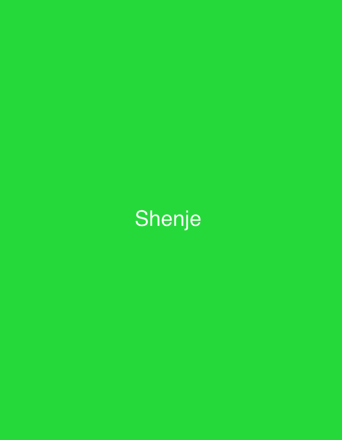 A solid, bright green background occupies the entire frame of the image. Centered on the background is the white text "Shenje". The image does not contain any contextual elements that would allow for a description of a location in the city of Shumen, Bulgaria, nor any people, subjects, objects, or actions.