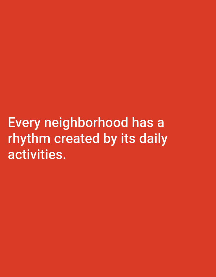 The image shows white text on a solid red background. The text reads "Every neighborhood has a rhythm created by its daily activities." There are no people, objects, or environmental details present in the image, and therefore no information can be inferred about the city of Payaman, Indonesia.