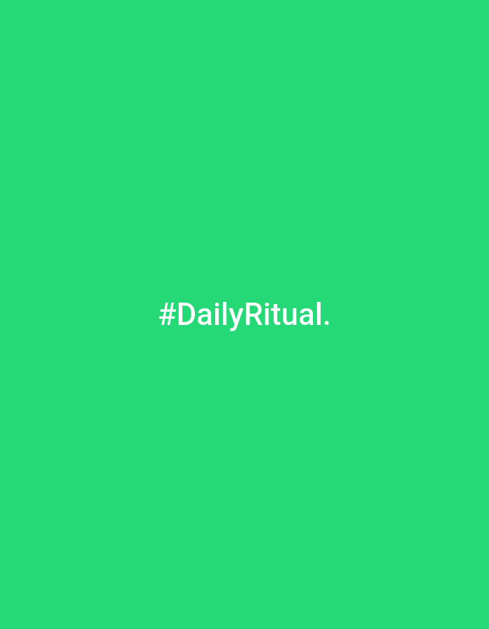 The image displays a minimalist graphic featuring white text centered against a solid, vibrant green background. The visible text is "#DailyRitual." with a period at the end. The text uses a clean, sans-serif font. There are no other subjects, objects, people, or activities depicted. The scene provides no specific location cues, time of day, or weather information. The overall impression is that of a digital graphic or a social media post, emphasizing a concept or theme rather than a physical scene.