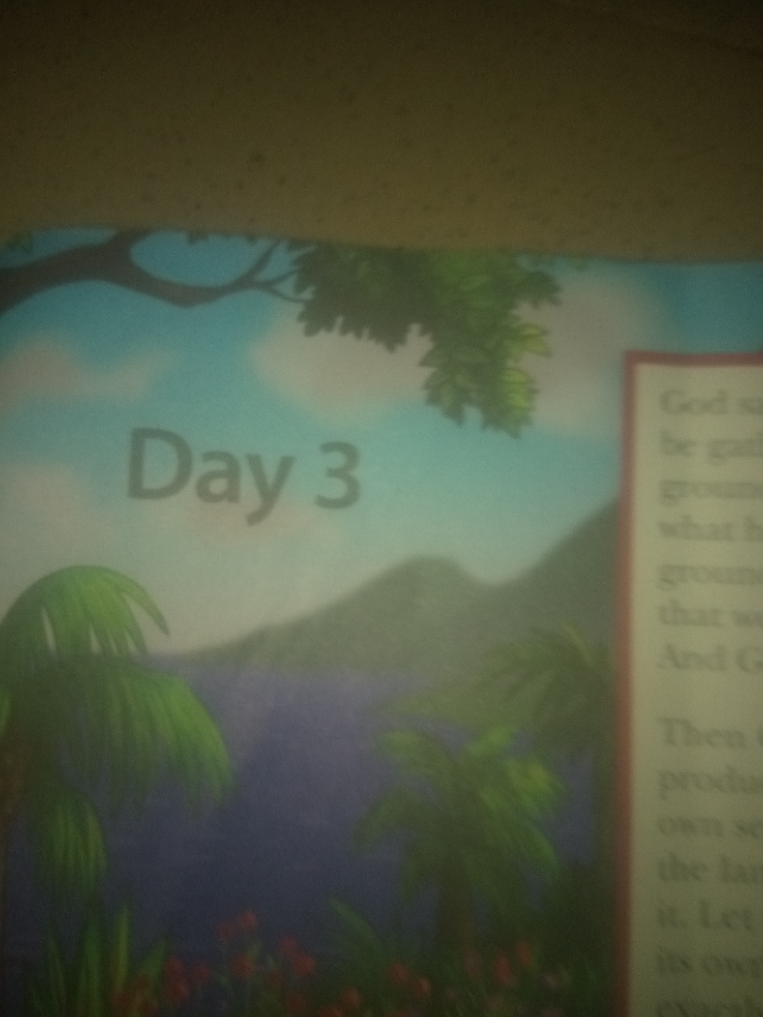 The image shows a book with the words "Day 3" in large, faded gray letters on a sky-blue background. To the right, there is text within a red-bordered box. The text is blurry but appears to be from a religious text, possibly Genesis, with phrases like "God said," "be gathered," "ground," and "its own." The scene depicts a cartoonish landscape with green palm trees and a distant mountain range. There are no people or animals visible, nor any indication of the city of Jauro Yinu, Nigeria.