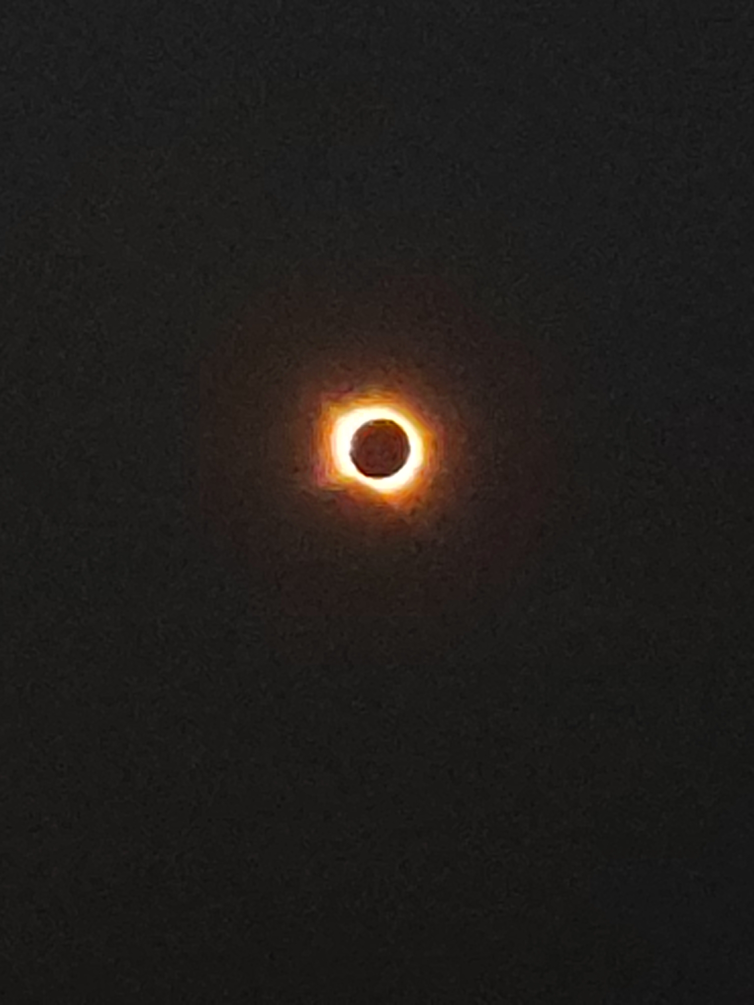 An image of a solar eclipse is shown, with the sun partially obscured by the moon, creating a ring of light around the moon. The sky is dark and appears to be night. The location in Autillo de Campos, Spain, is not evident from the image.