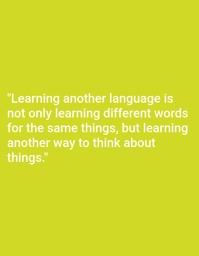 The image is a quote in white text against a lime green background. The quote reads: "Learning another language is not only learning different words for the same things, but learning another way to think about things." There are no people, objects, actions, interactions, or environmental details visible in the image. The location in the city of Payagaboh, Indonesia is not depicted.