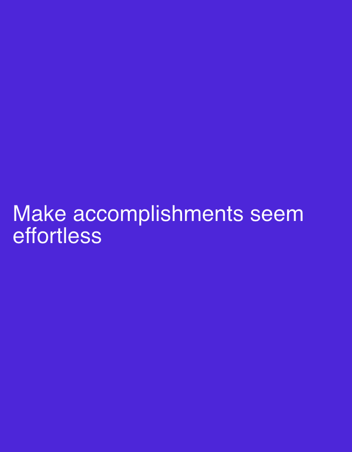 The image displays white text on a solid purple background. The text reads: "Make accomplishments seem effortless". There are no people, objects, or environmental details present in the image. The location of New Stadium, Nigeria, is irrelevant to the content of this image.