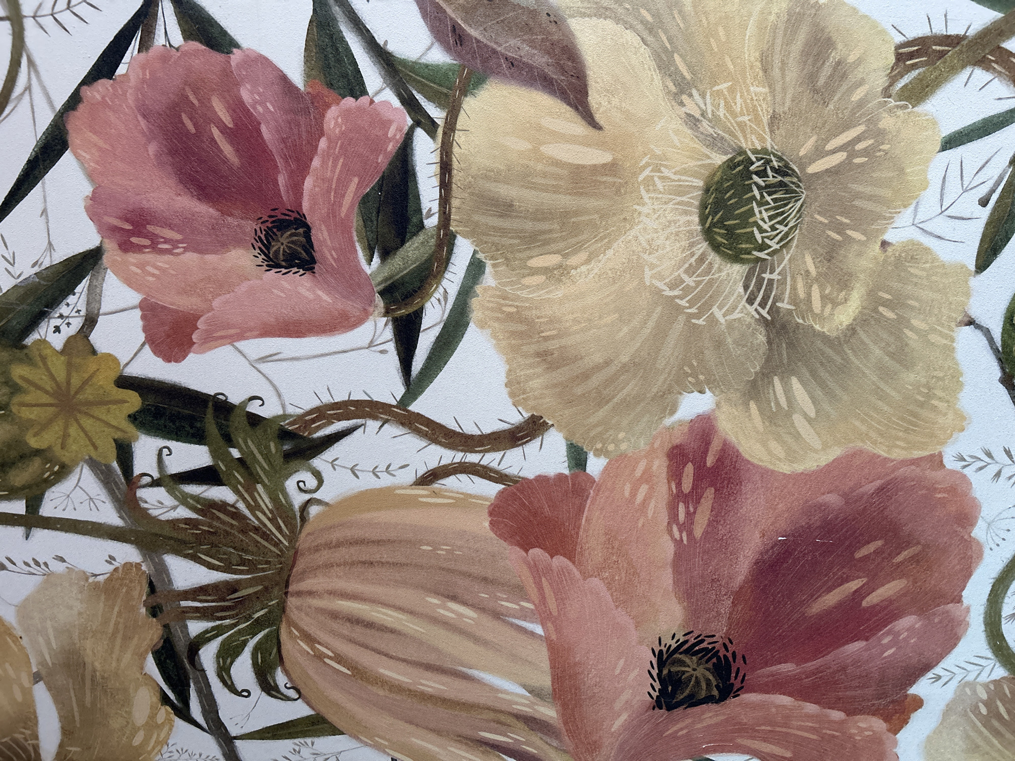 The image is a close-up painting of various flowers and foliage. Predominantly, there are three large poppy-like flowers in focus. One is a muted pink, situated towards the upper-left, with a dark center. Another flower, positioned to the upper-right, is a pale yellow color with a textured green center. A third, peach-toned flower is at the bottom center. Green leaves and brown thorny vines meander around the flowers. A small yellow, star-shaped flower is present in the lower-left. The background is a plain white. The style is illustrative and painterly. There is no indication of location in Moscow or Russia.
