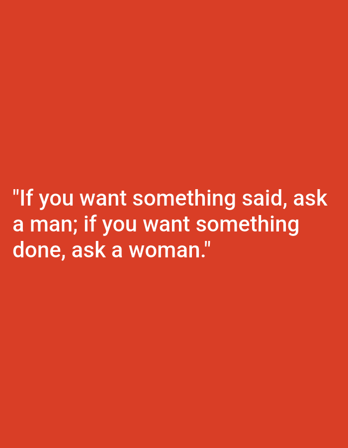 The image is a photograph of a white text quote on a red background. The quote reads: "If you want something said, ask a man; if you want something done, ask a woman." There are no people, objects, or specific environmental details present in the image beyond the text and background. The location of Nowa Wieś Książęca, Poland is not visually represented in the image.