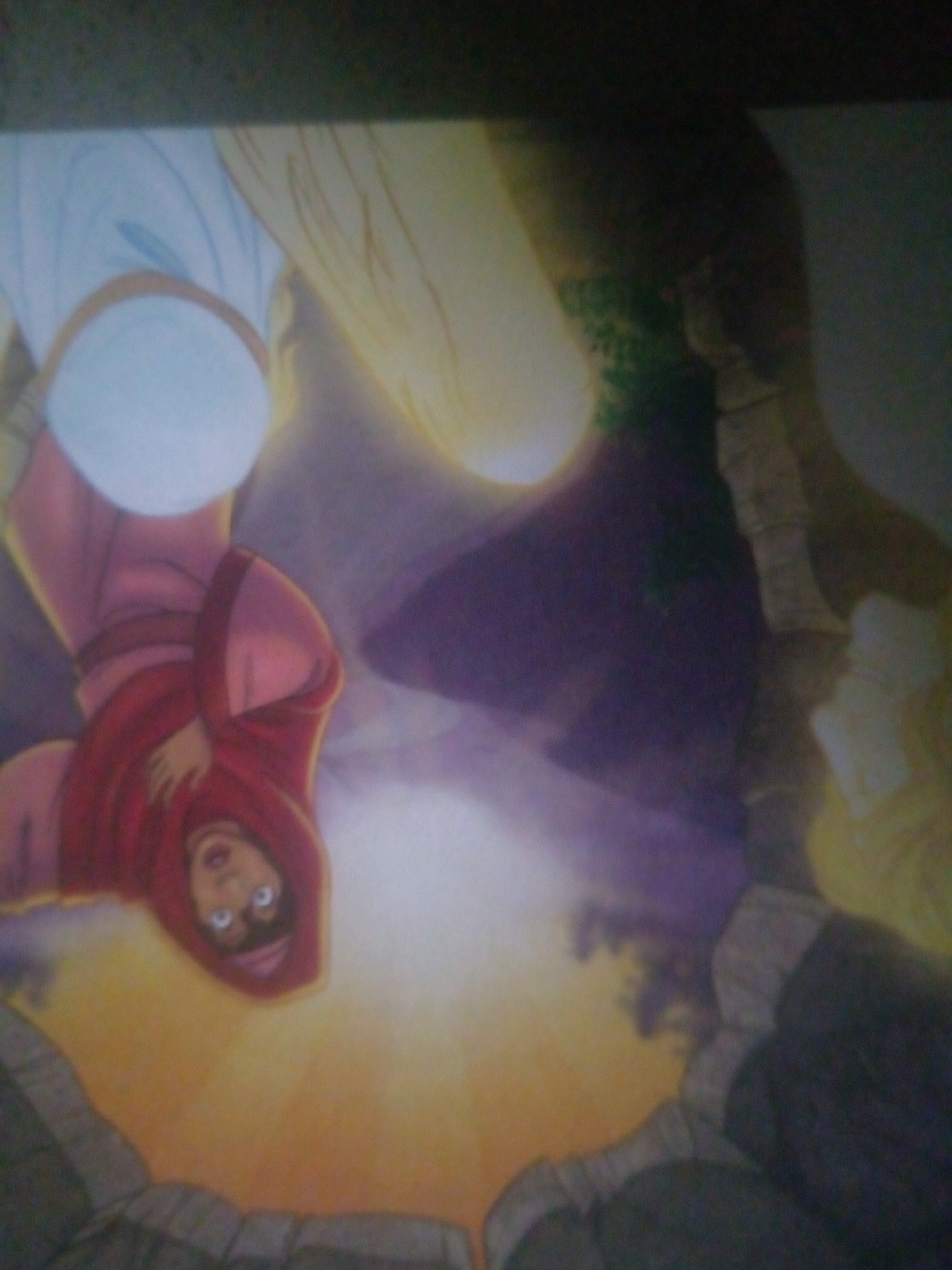 The image is a photograph of a painting that appears to depict a scene with two figures. The left figure is a young woman or girl wearing a red garment and a light blue garment underneath, with her eyes wide open and looking upwards. She is positioned in the foreground. To the right of her, a portion of another figure with blonde hair is visible. The background features rocky terrain and a bright, light source, possibly representing a sun or divine light. The overall impression is one of awe or surprise. The image is rotated such that the figures appear upside down. There is no discernible information in the image that can definitively place it within the city of Jalingo, Nigeria.