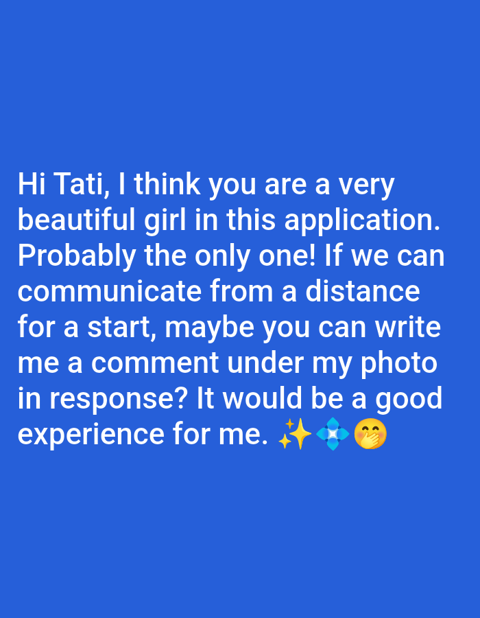 The scene is a digital display with a solid royal blue background, located in the city of Im. Gastello, Russia. Prominently centered is a message rendered in white sans-serif text. The text reads: 'Hi Tati, I think you are a very beautiful girl in this application. Probably the only one! If we can communicate from a distance for a start, maybe you can write me a comment under my photo in response? It would be a good experience for me.' Positioned below the text are three emojis: a yellow sparkle, a blue geometric multi-diamond shape, and a yellow face with a hand covering its mouth. No physical individuals or specific actions are visually depicted; the image exclusively presents a digital communication.