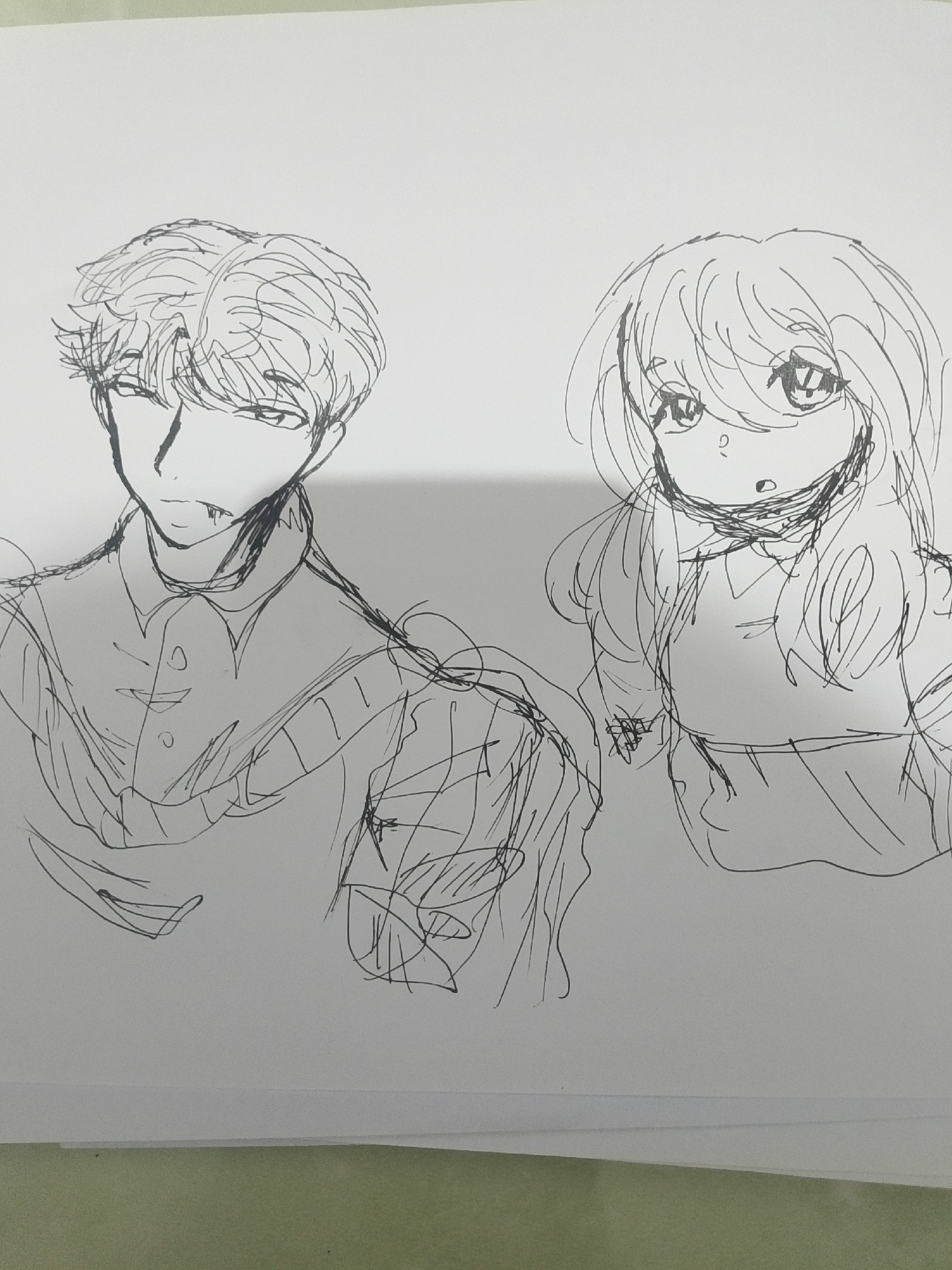 The image is a black and white sketch on white paper, depicting two figures. On the left is a male figure with messy hair, sharp features, and a slightly open mouth revealing fangs. He is wearing a collared shirt with buttons and a scarf or draped fabric around his neck. On the right is a female figure with long, wavy hair, large expressive eyes, and an open mouth. She appears to be wearing a dress or a top with straps. Both figures are drawn in a loose, sketchy style, with visible linework and shading. The background is blank white paper. There is no indication of the city of Se'pon, Indonesia, or any specific location within it.