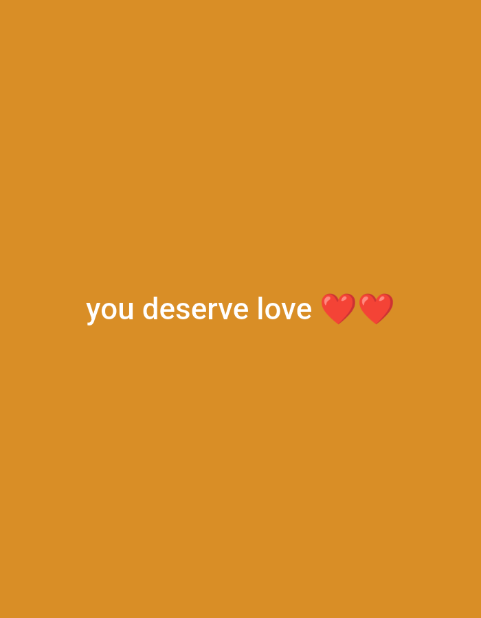 An image displays the text "you deserve love" in white, sans-serif font. The text is positioned in the center of the frame against an orange background. To the right of the text, there are two red heart emojis.