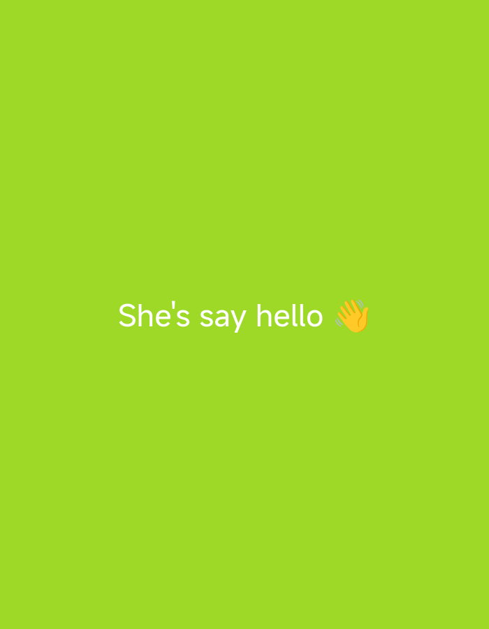 The image is a plain green background with white text that reads "She's say hello" and a waving hand emoji. There are no people, objects, or interactions visible in the image. The location in the city of Nsugpe, Nigeria is not depicted or implied by the image content.