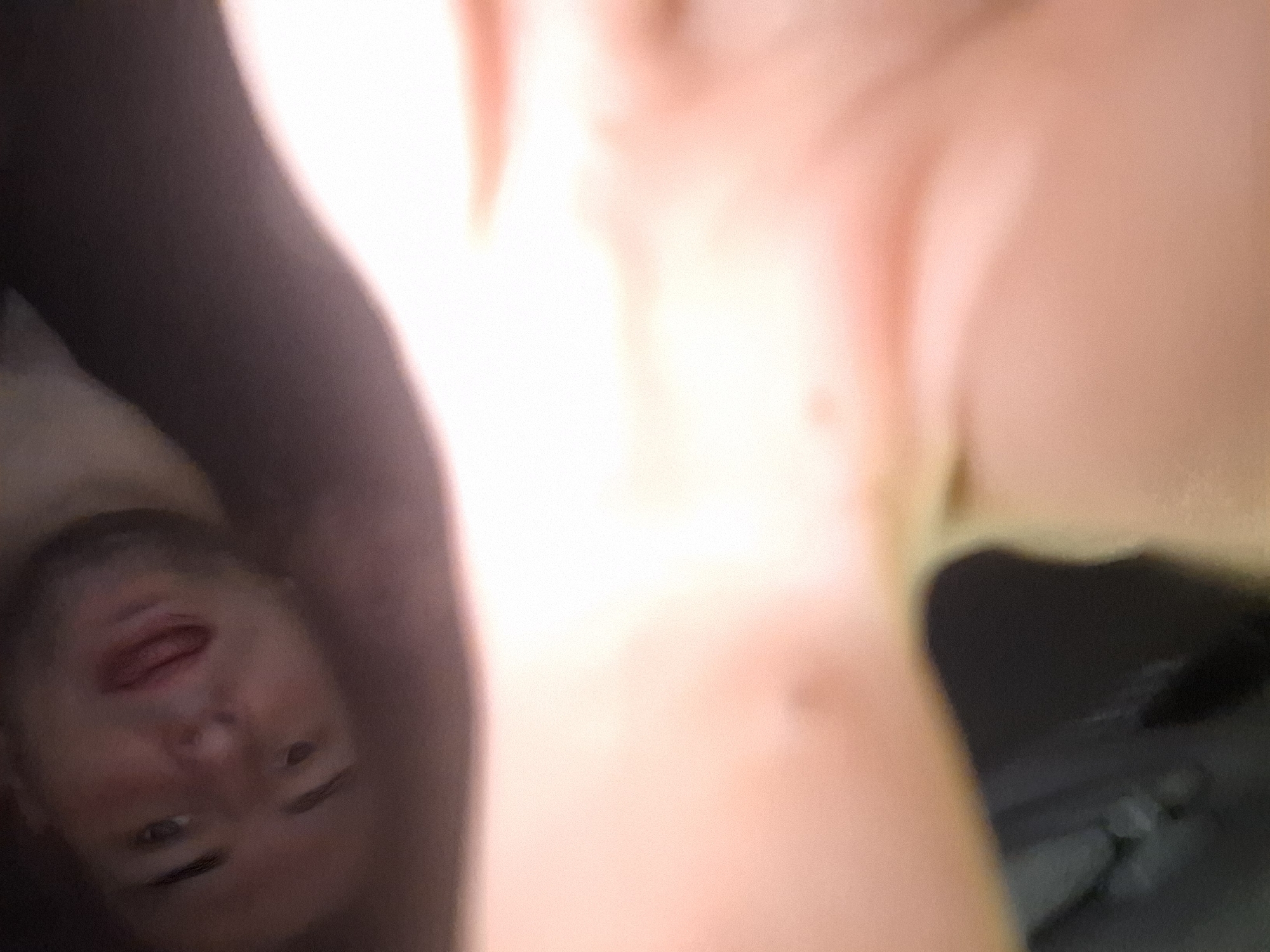 The image shows a man's face in the lower left quadrant of the frame. The rest of the image is filled with bright, out-of-focus skin tones, suggesting a close-up, possibly a selfie. There are no discernible details to determine the location in Sofia, Bulgaria.