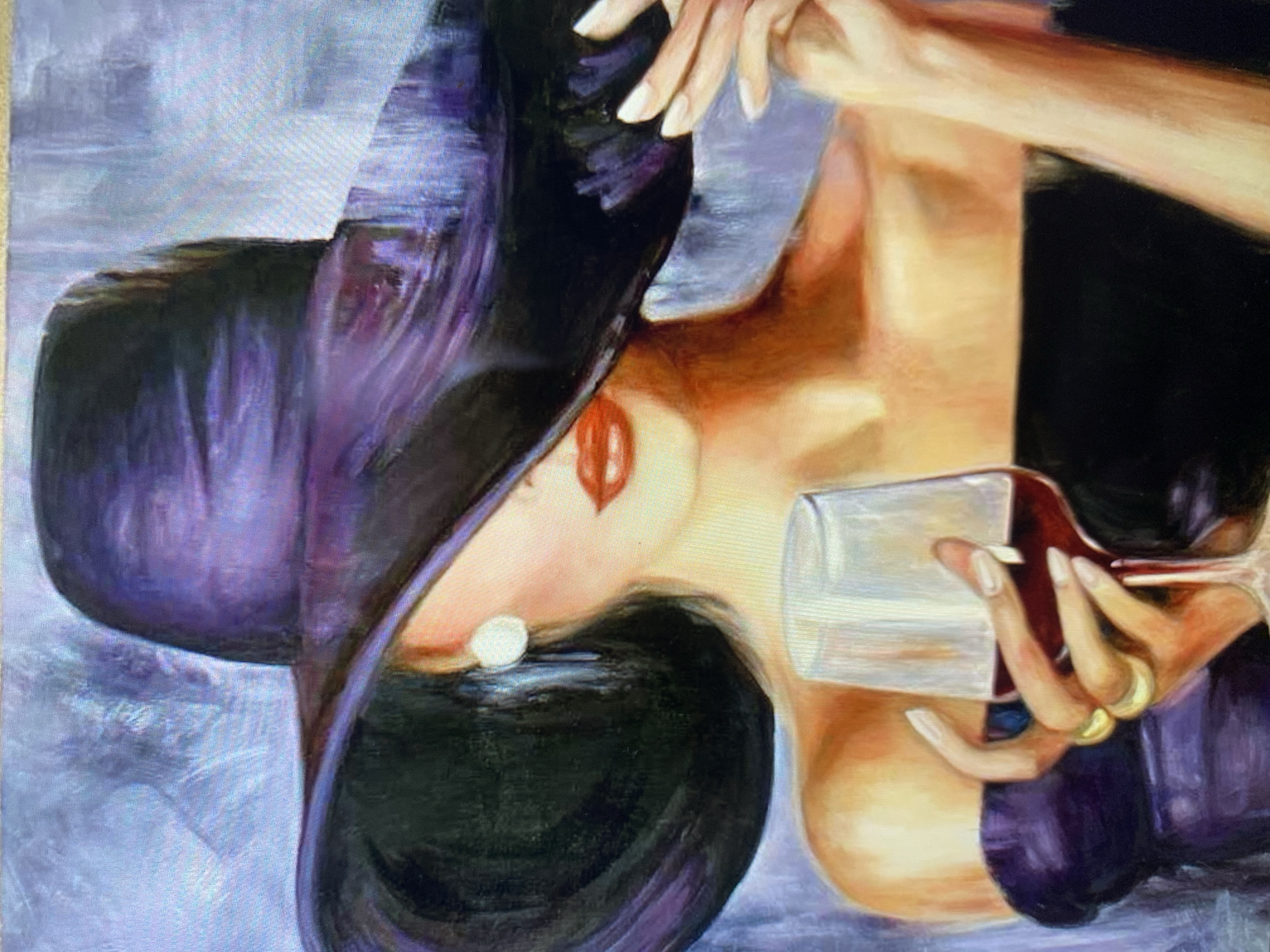 A painting depicts a woman from the chest up, wearing a wide-brimmed purple hat and a black off-the-shoulder top. She holds a glass of red wine in her left hand, adorned with two gold rings. Her right hand adjusts the brim of her hat. A pearl earring is visible on her left ear. Her lips are painted red. The background is a textured blend of purples and blues.