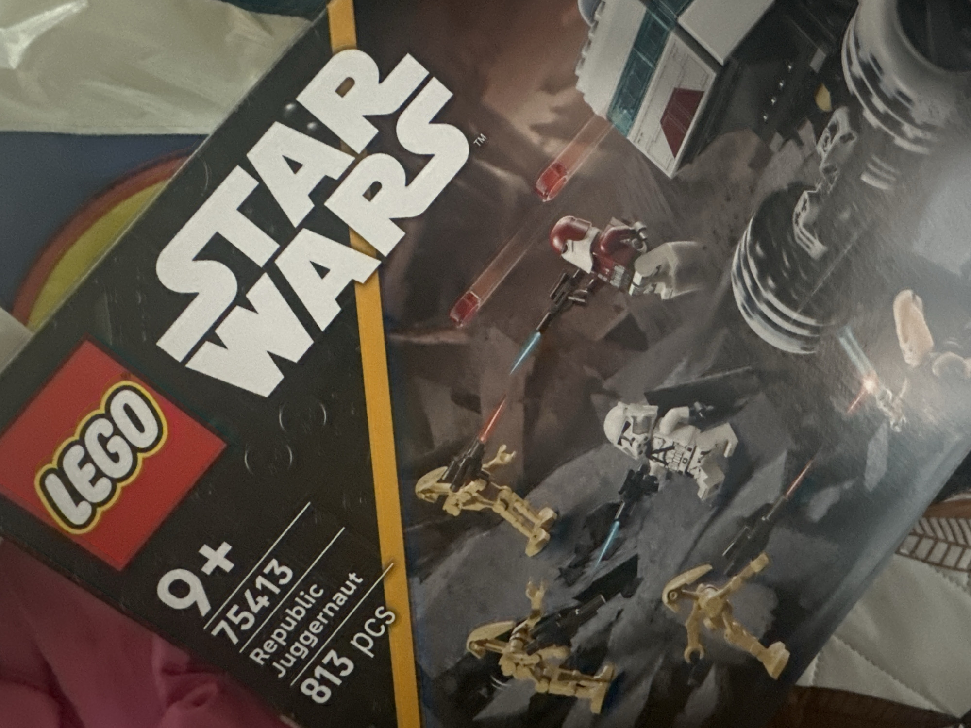 The image shows a Lego Star Wars set, specifically the "Republic Juggernaut" (set number 75413) for ages 9+. The box features the Lego logo in the bottom left corner. The set contains 813 pieces. The image on the box depicts battle droids and clone troopers in a combat scene, alongside the titular juggernaut vehicle. There is no indication that the image was taken in Sofia, Bulgaria.