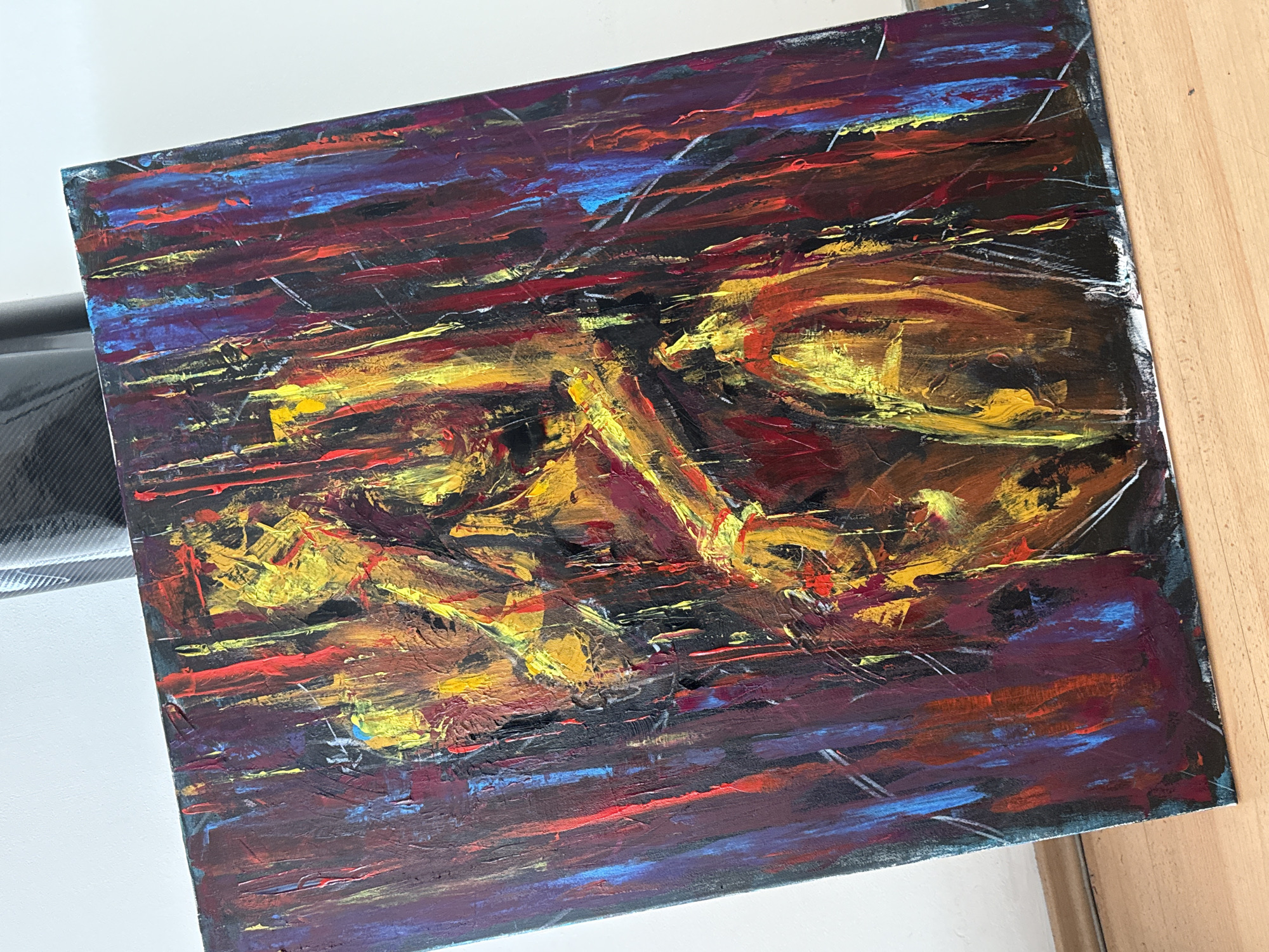 The image is of an abstract painting. The painting is dominated by hues of yellow, red, and purple. The brushstrokes are bold and textural. It is not possible to identify a specific location or city from the image.