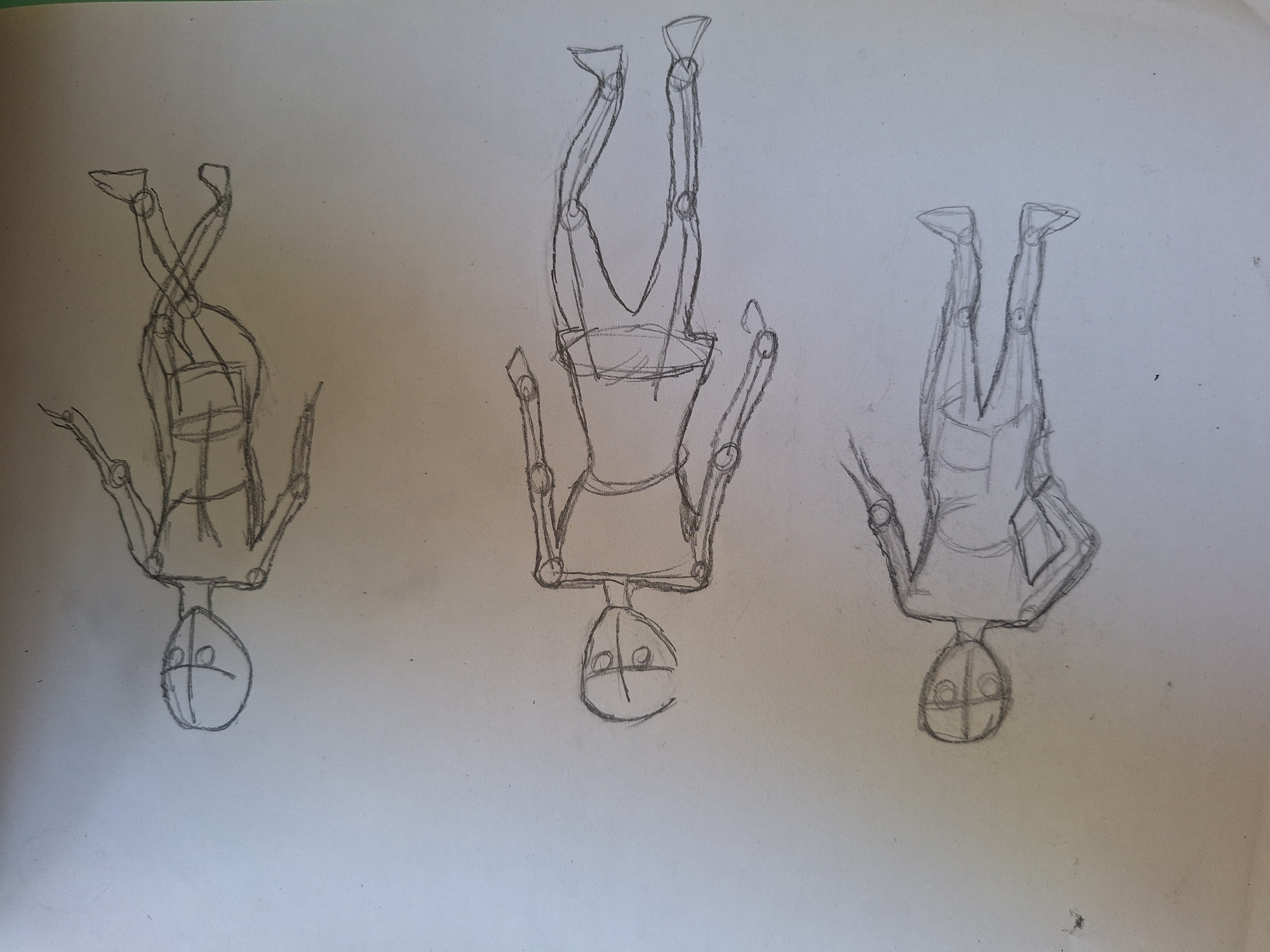The image contains three unfinished pencil sketches of human figures on a light-colored paper. The sketches are oriented with the heads pointing towards the top of the image and are arranged vertically. Each sketch depicts a skeletal structure of a body, with basic shapes for the head, torso, arms, and legs, and circles indicating joints. The figures are drawn in different poses: the top figure appears to be in a running or jumping motion, the middle figure is lying down or in a relaxed pose, and the bottom figure is in a seated or crouching position. There are no indications of a specific location within the city of Varna, Bulgaria, or any other environmental details.