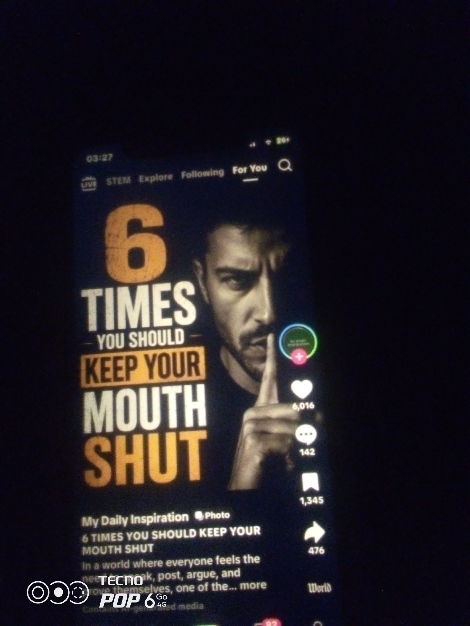 The image shows a close-up of a smartphone screen displaying a TikTok video. The video features a man with his finger to his lips, in a gesture of silence. The text overlay on the video reads "6 TIMES YOU SHOULD KEEP YOUR MOUTH SHUT." There are various TikTok engagement icons visible, including a heart with 6,016 likes, a comment icon with 142 comments, and a share icon with 1,345 shares. The screen also displays the time "03:27" and navigation options like "LIVE," "STEM," "Explore," "Following," and "For You." A watermark at the bottom of the screen indicates "TECNO POP 6 4G." The background is dark, suggesting the photo was taken in a dimly lit environment. The location in the city of Howayi, Nigeria, is not discernible from the image itself.