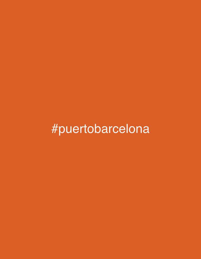 The image is an orange background with the white text "#puertobarcelona" in the center. This suggests a connection to the port area of Barcelona, Spain.