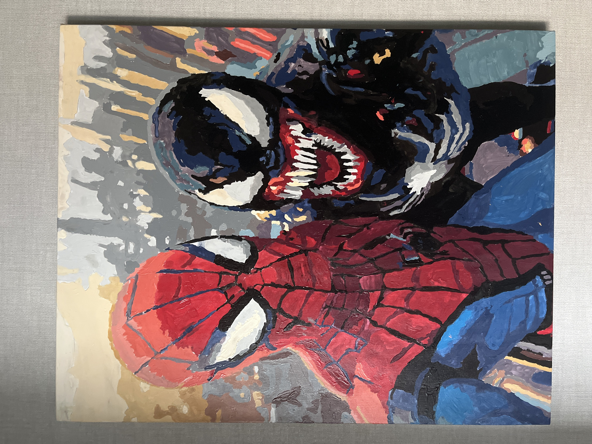 This is an oil painting on canvas depicting Spider-Man and Venom. Spider-Man is on the left, facing forward, with his iconic red and blue suit, complete with the spiderweb pattern. Venom is on the right, with his black suit and white eyes, his mouth open to reveal sharp teeth. The background is abstract, with blurred shapes and colors suggesting a cityscape. The painting is framed by a plain gray wall. There is no indication that this scene is located in Nizhny Novgorod, Russia.