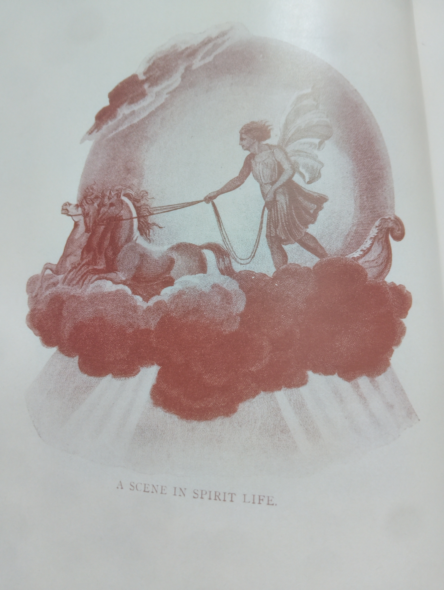 The image depicts a vintage illustration with a sepia-toned aesthetic. The central subject is a winged human figure, likely a deity or angel, with flowing hair and draped clothing, holding reins connected to two horses. The horses appear to be in motion, perhaps pulling a chariot or carriage made of clouds. The scene is set against a backdrop of swirling clouds and a radiant, arched sky, suggesting a celestial or ethereal environment. Below the main illustration, there is text that reads "A SCENE IN SPIRIT LIFE." The image is rendered in a style that suggests a historical print or engraving, with fine linework and subtle shading. There is no discernible connection to the city of Alagbado, Nigeria, as the image's content is symbolic and allegorical, not representative of a specific geographical location or event.