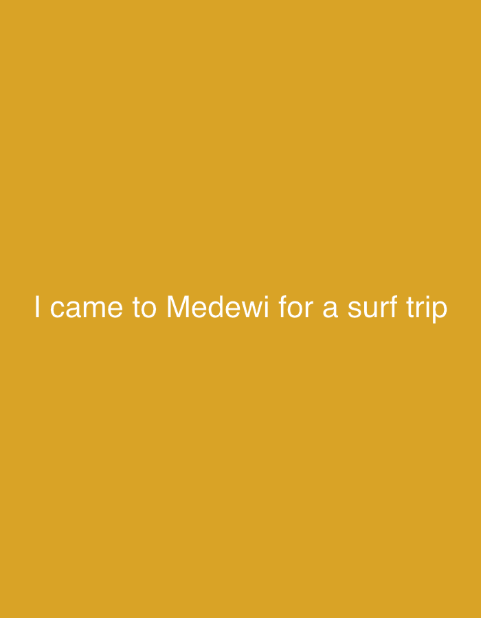 A centered text on an evenly lit, mustard-yellow background reads "I came to Medewi for a surf trip."