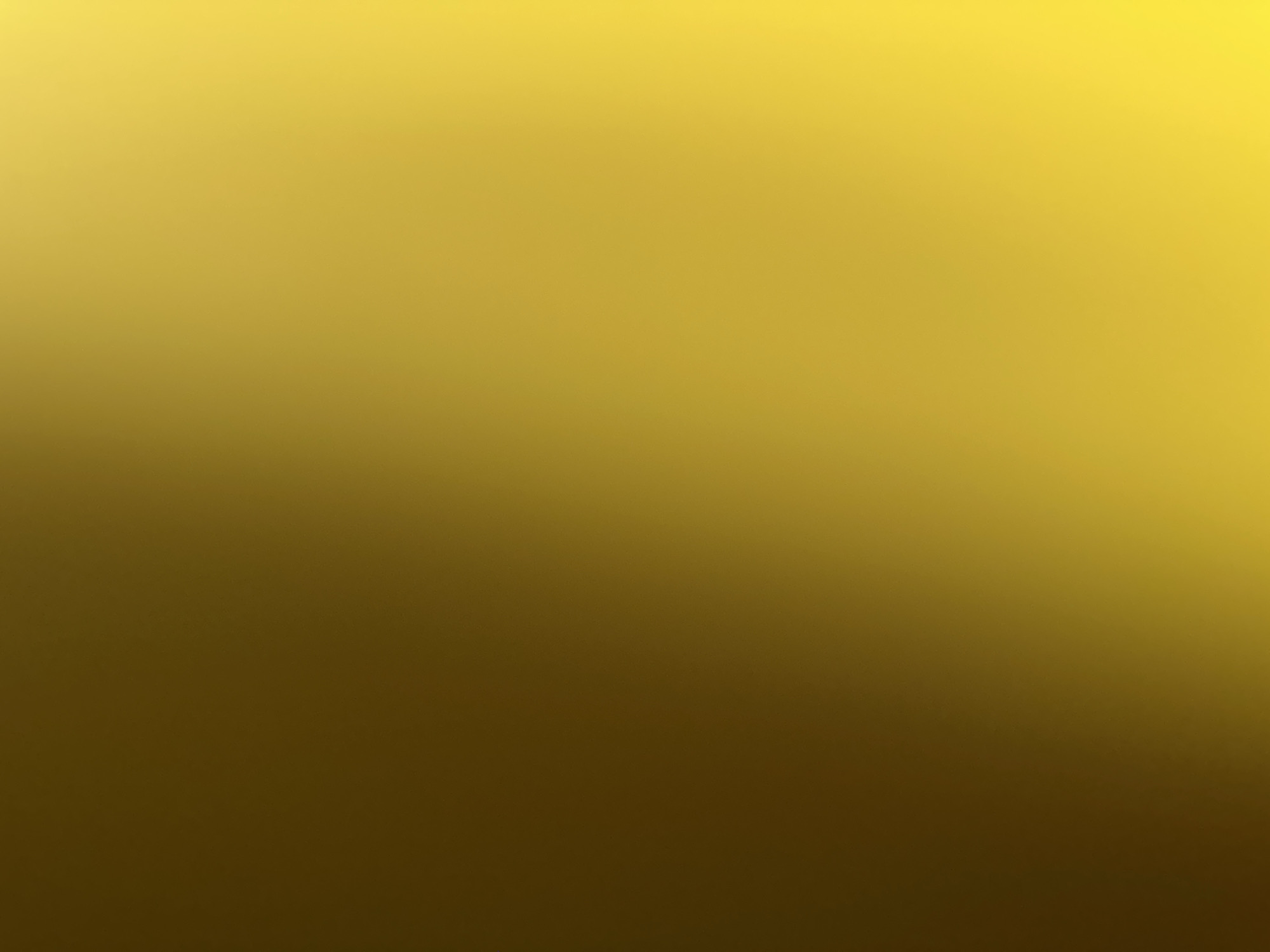 This is a digital image featuring a gradient of yellow and brown colors, transitioning from a bright, almost golden yellow at the top to a dark, muted brown at the bottom. There are no discernible subjects such as people, objects, or any specific scene depicted. The image is a smooth, abstract color blend with a subtle grainy texture visible upon closer inspection, particularly in the darker areas. There are no indicators of time of day, weather, location, or any specific activity. The image is entirely abstract and lacks any visible text.