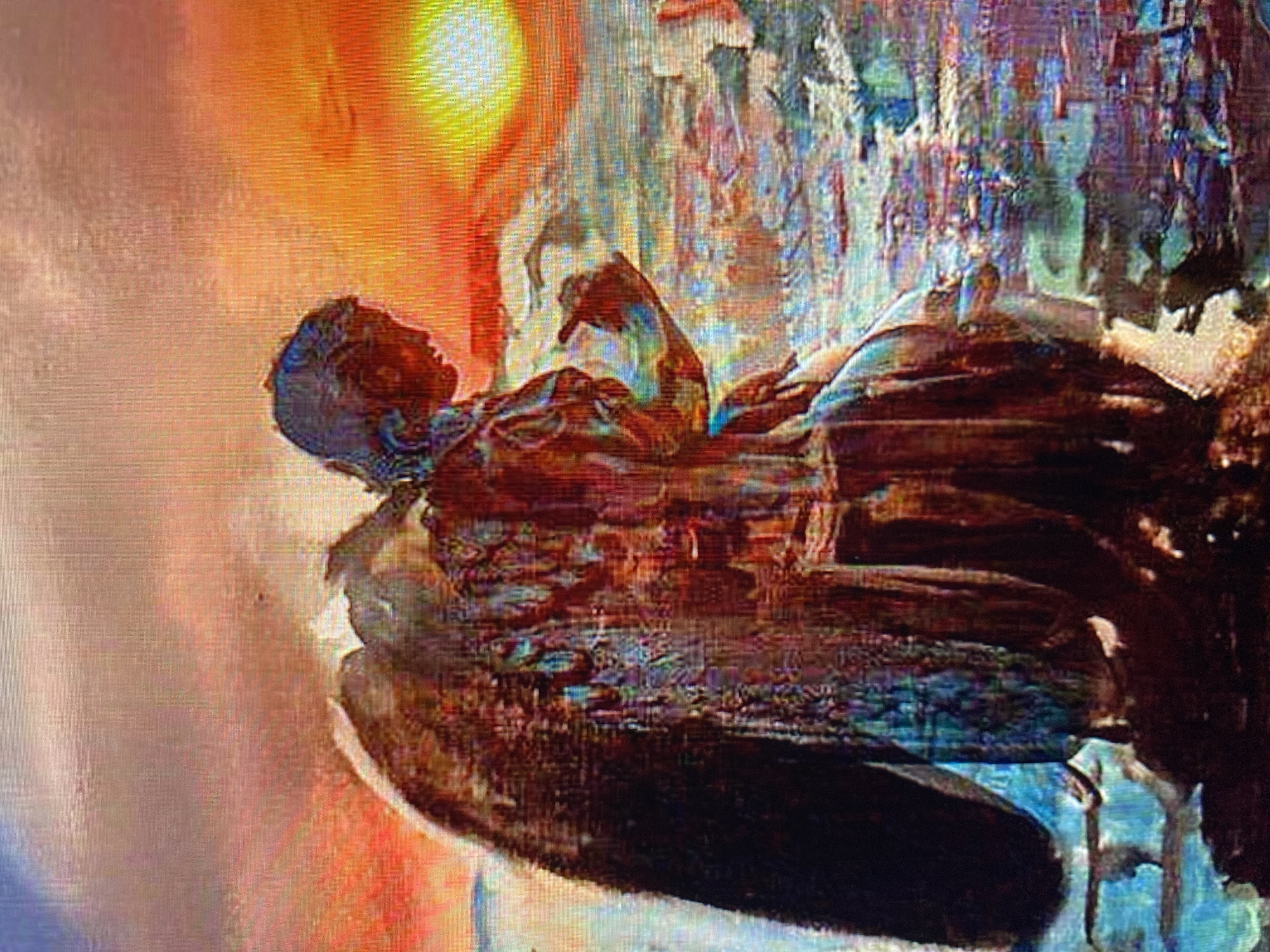 The artwork depicts a winged figure, possibly an angel, in profile, gazing downwards. The figure is rendered in a painterly style with a mosaic of colors and textures, suggesting a dreamlike or ethereal quality. The background features a vibrant sunset with hues of orange, yellow, and red. Below the figure, the scene transitions to a body of water with what appear to be structures or landmasses rendered in abstract brushstrokes. The figure's left arm is bent, with its hand held near its face, and the right arm is extended slightly forward, with the index finger pointing. The overall impression is one of contemplation or observation against a dramatic natural backdrop. The location within the city of Unknown, Unknown is not determinable from the image.