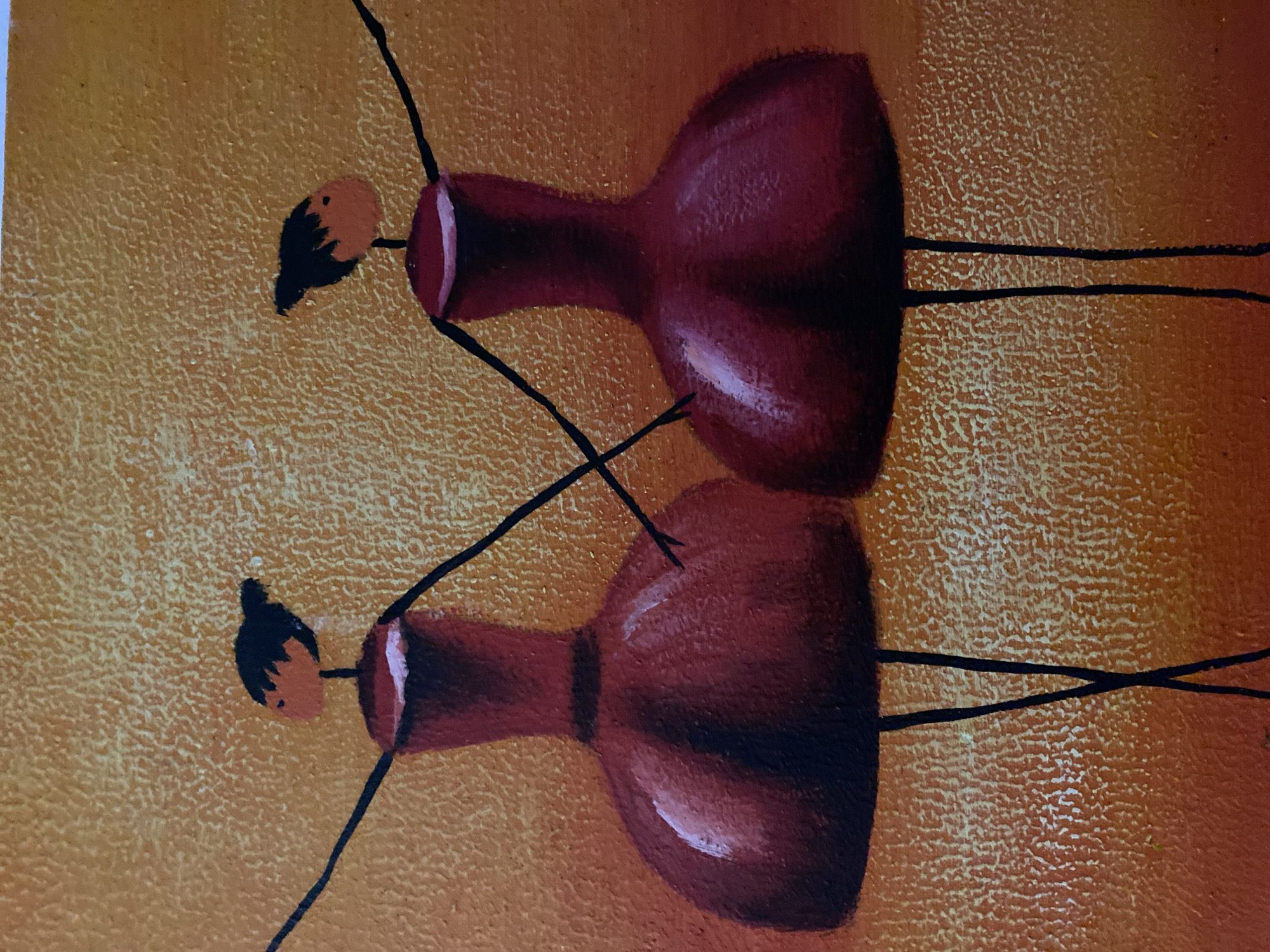 The image shows an abstract painting featuring two stylized figures with vase-shaped bodies in a reddish-brown hue. Each figure has a small, round head with black hair and thin, black limbs. The figures are positioned one above the other on a textured background, which transitions from yellow to orange. The style is reminiscent of folk art or naive art. The image has no indicators that it is located in Budva, Montenegro.