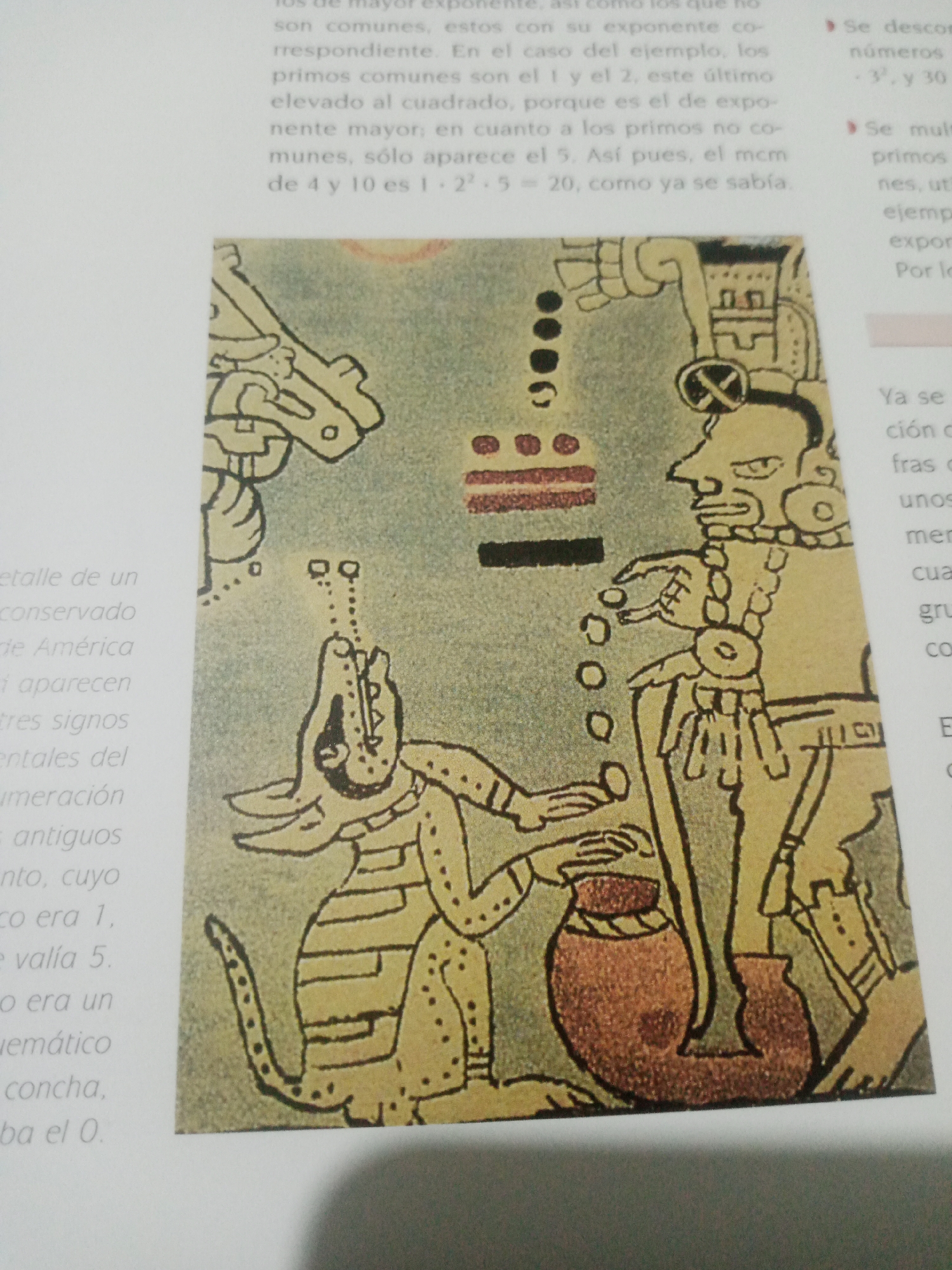 The image shows a drawing of a Mayan scene depicting two figures and a creature. One figure, on the right, is larger and appears to be a man with elaborate headdress and jewelry. He is holding a staff and gesturing towards the other figure. The other figure, on the left, is smaller and resembles a serpent or dragon-like creature with paws and a long tail. It is reaching towards the man and appears to be interacting with a pot. A series of circular and rectangular symbols are arranged above and between the figures. The drawing style is characteristic of ancient Mayan art. The text on the left provides context about Mayan numerals, discussing concepts like common factors and exponents in relation to their number system. The text on the right discusses numbers, common factors, and their use in calculation. The location of Santa Ana, Venezuela is not mentioned in the image or its context.