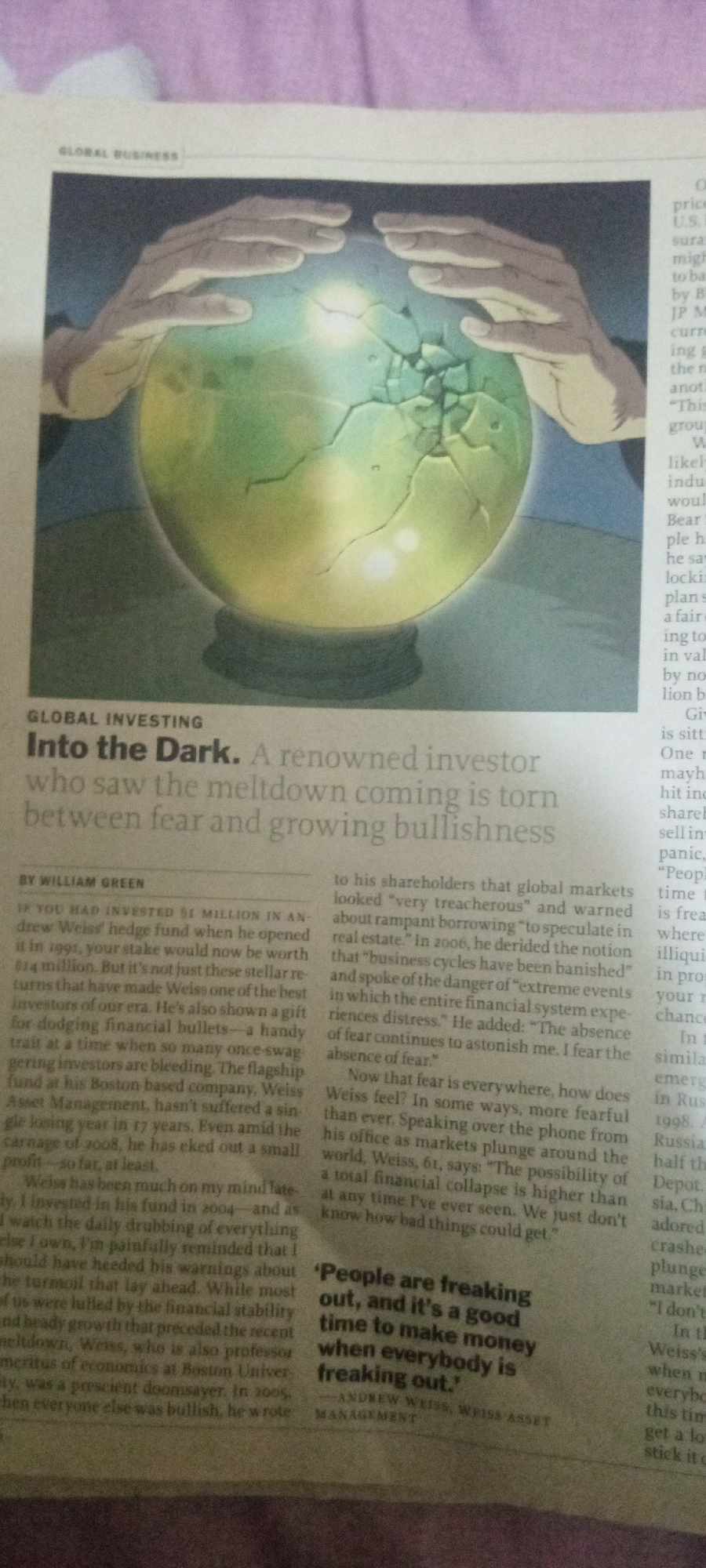 The image shows a newspaper clipping. The headline reads "GLOBAL INVESTING Into the Dark. A renowned investor who saw the meltdown coming is torn between fear and growing bullishness." The article is by WILLIAM GREEN. There is an illustration of two hands holding a cracked crystal ball with a light emanating from inside it. The image does not contain any information about Jalingo, Nigeria.