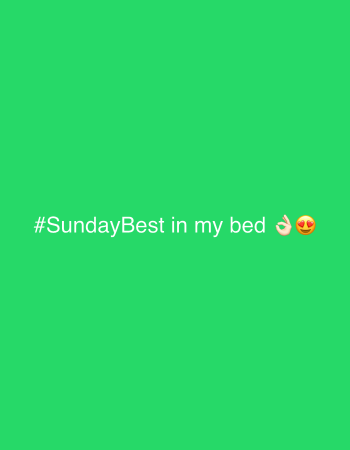 The image is a digital graphic with a bright green background. Centered on the lower portion of the graphic is white text that reads "#SundayBest in my bed" followed by two emojis: an "OK hand" emoji and a "face with hearts" emoji. There is no indication of the city of Slavyani, Bulgaria, in this image.