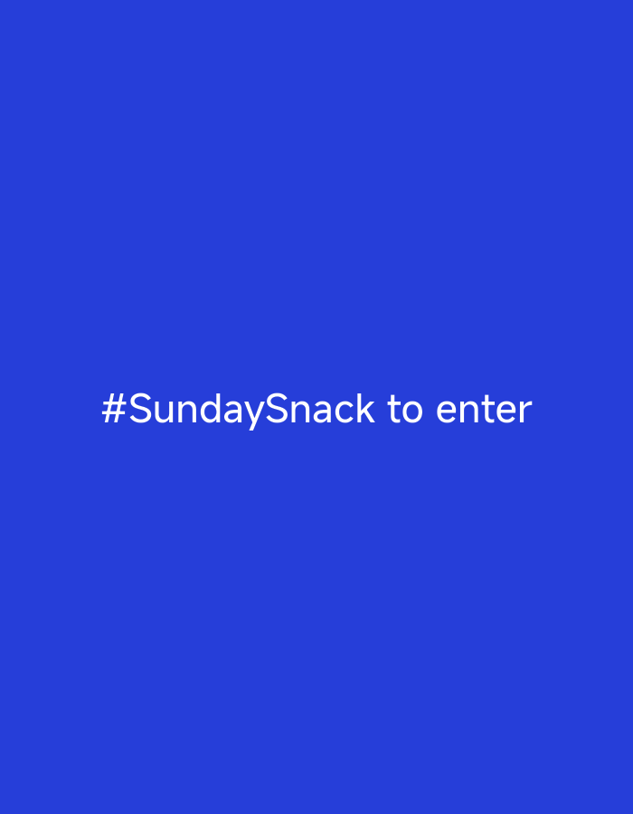 The image displays a solid royal blue background with white text centered on the screen. The text reads "#SundaySnack to enter". There are no people, objects, or environmental details visible in the image, and no specific location within the city of Октябрьский Снт, Russia can be determined.