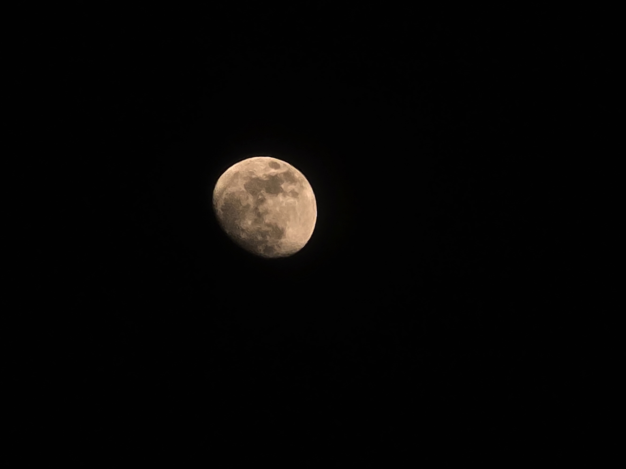 The image shows a full moon against a black sky. The moon is partially illuminated, with visible craters and texture on its surface. The overall impression is of a clear night sky. There are no discernible elements in the image that could indicate a specific location within Yambol, Bulgaria, or any human presence.