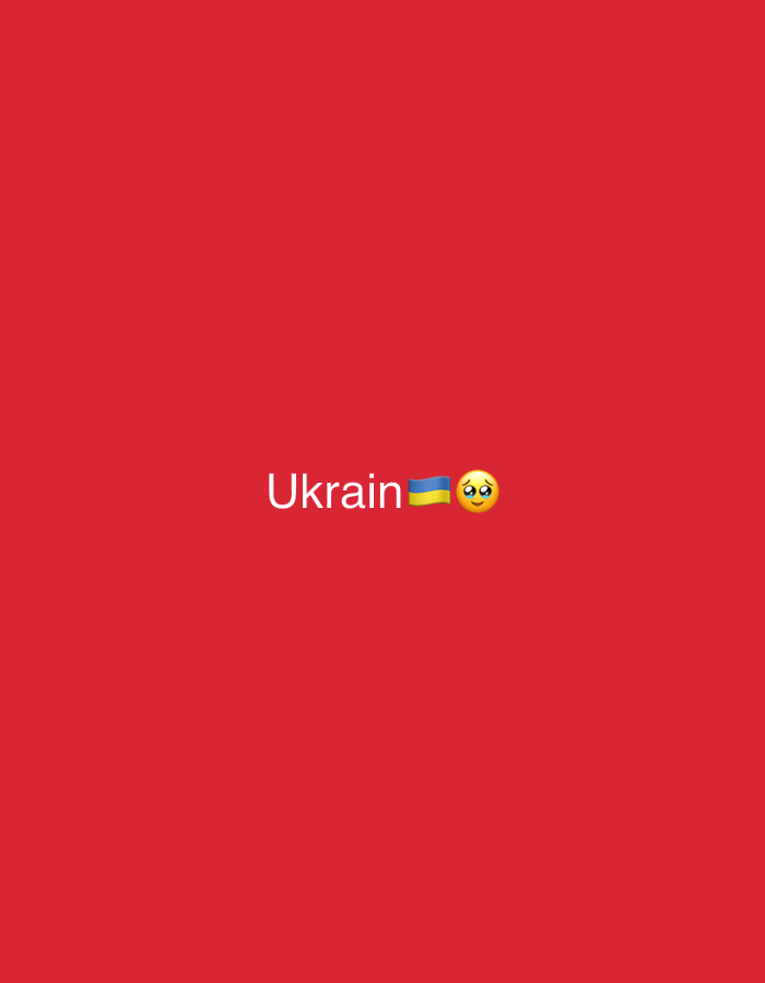 The image is a plain red background with the word "Ukrain" written in white text. To the right of the text is a Ukrainian flag emoji, followed by a crying face emoji. The image appears to be a digital graphic or meme. There is no indication of a specific location in a city.