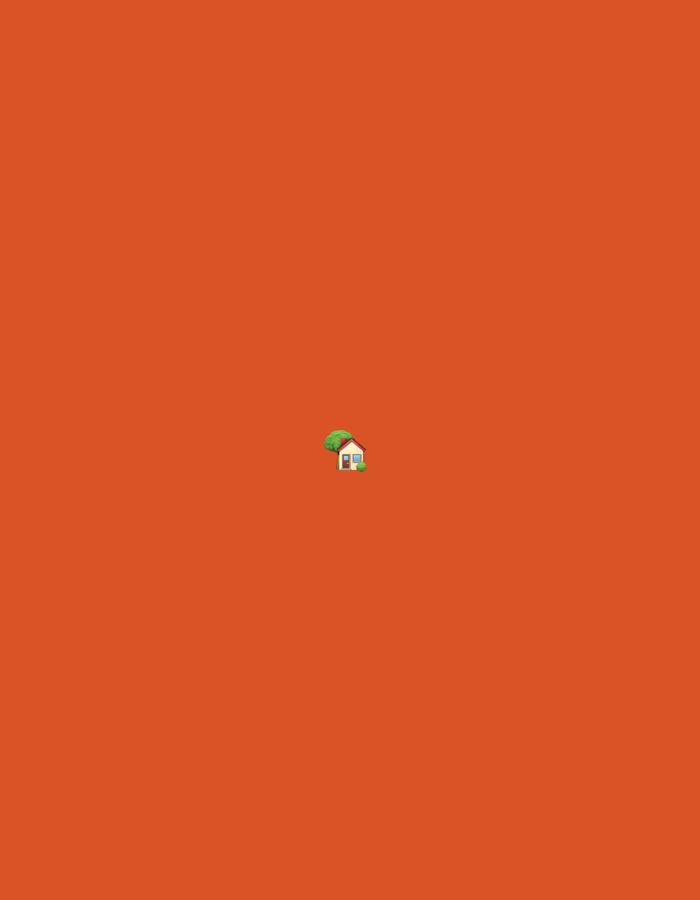 A small, cartoon-style house with a red roof and white walls, accompanied by a green tree, is centered on an orange background. The image is devoid of any specific location markers, people, or actions, and therefore cannot be placed in Moscow, Russia, or any other geographical context.