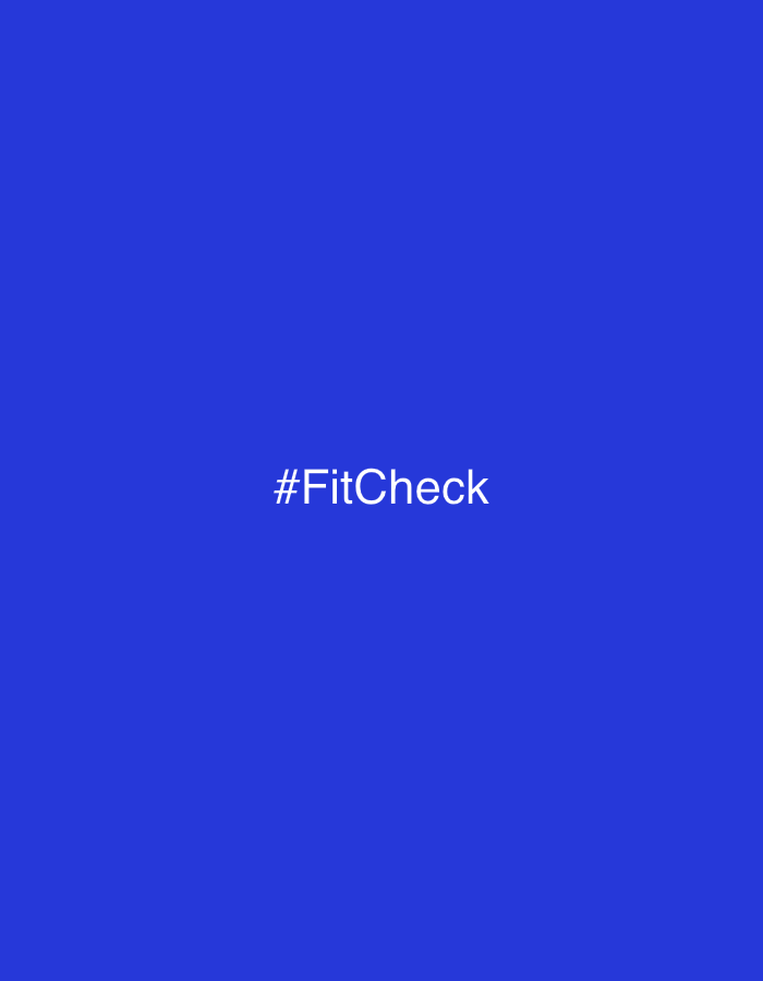 The image features a solid, vibrant blue background. Centered on this blue canvas is the white text "#FitCheck". There are no people, objects, or specific scenes depicted, making it a minimalist graphic. No activity or event is taking place, and there are no discernible location cues, weather conditions, or time of day indicated within the image itself that would link it to Saint Petersburg, Russia, or any other specific place. The only visible detail is the white hashtag phrase.