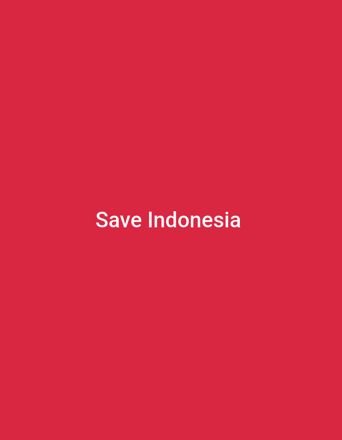 The image is a plain red background with white text centered on it that reads "Save Indonesia". There is no discernible location in Lhokseumawe, Indonesia, or any other urban setting. The image does not contain any people, subjects, objects, actions, interactions, or environmental details that could be considered a scene.