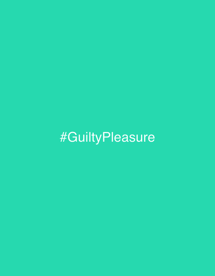 The image is a solid turquoise background with the hashtag "#GuiltyPleasure" in white, centered on the frame. There are no other elements. The image does not contain any information related to the city of Yerevan, Armenia.