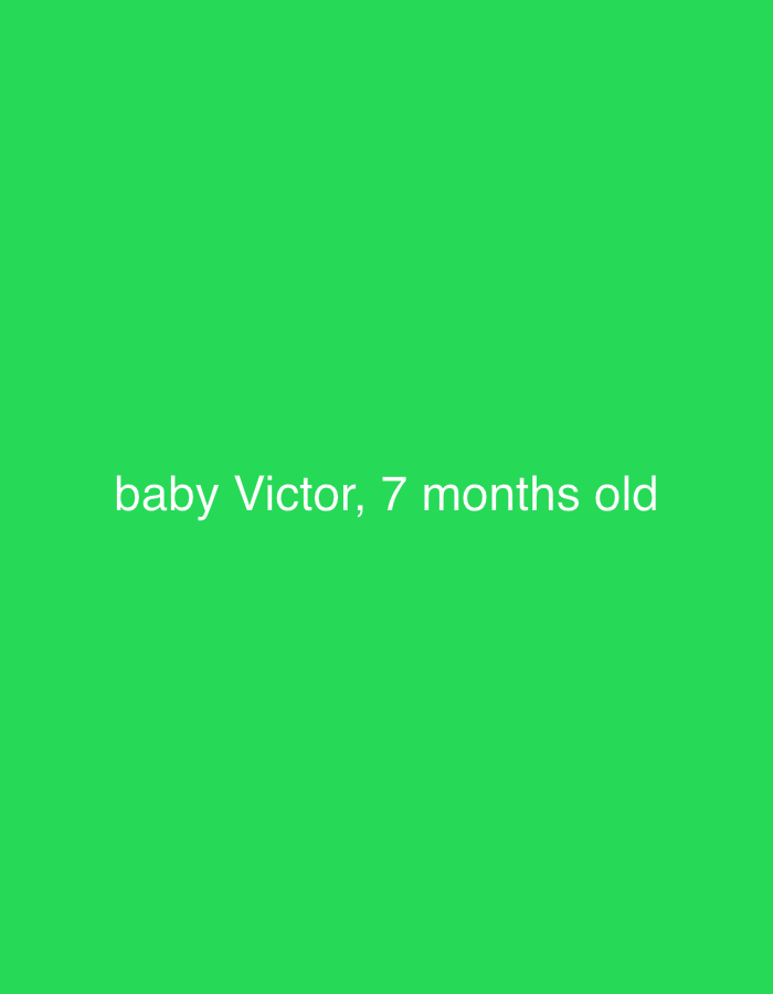 The image shows a green background with the text "baby Victor, 7 months old" in white. The location and other details are unknown.